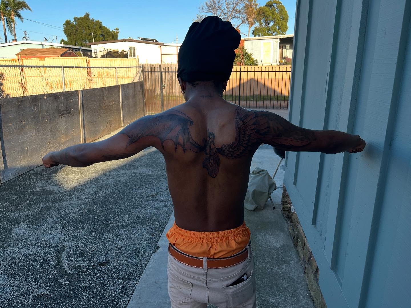 Wings neo-traditional tattoo on the back by Bris