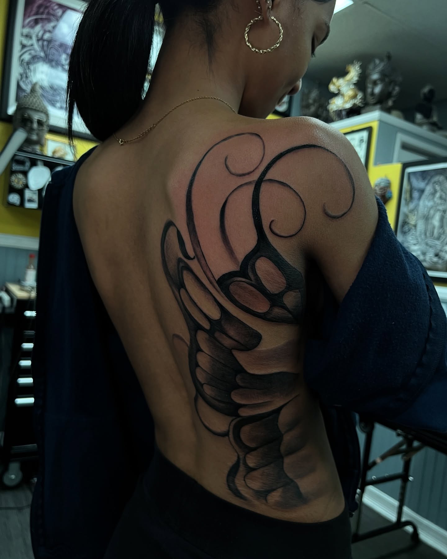 Wing black and grey tattoo on the back by Vondrae