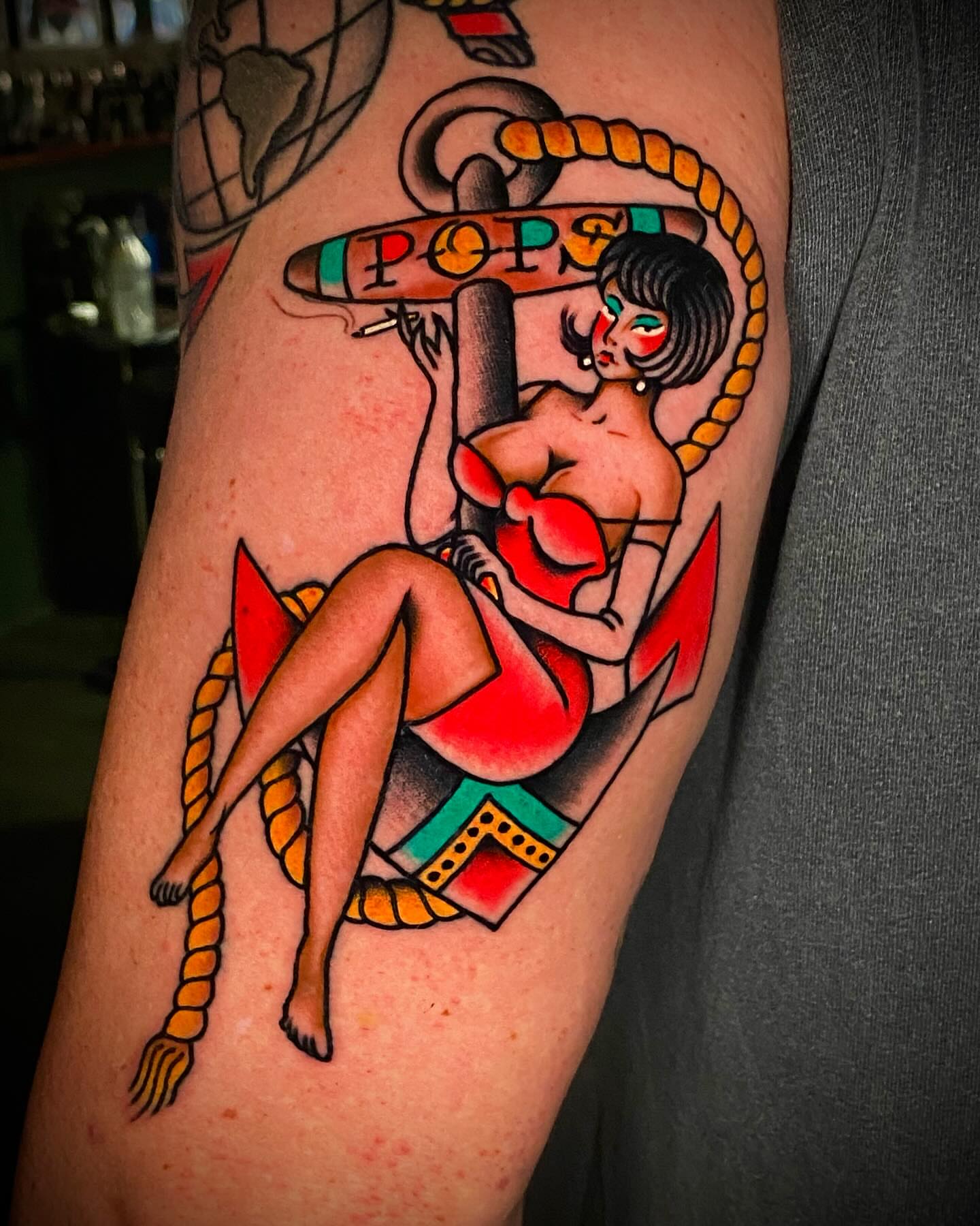 Nautical pin-up girl American traditional tattoo on the forearm by Alex Muniz