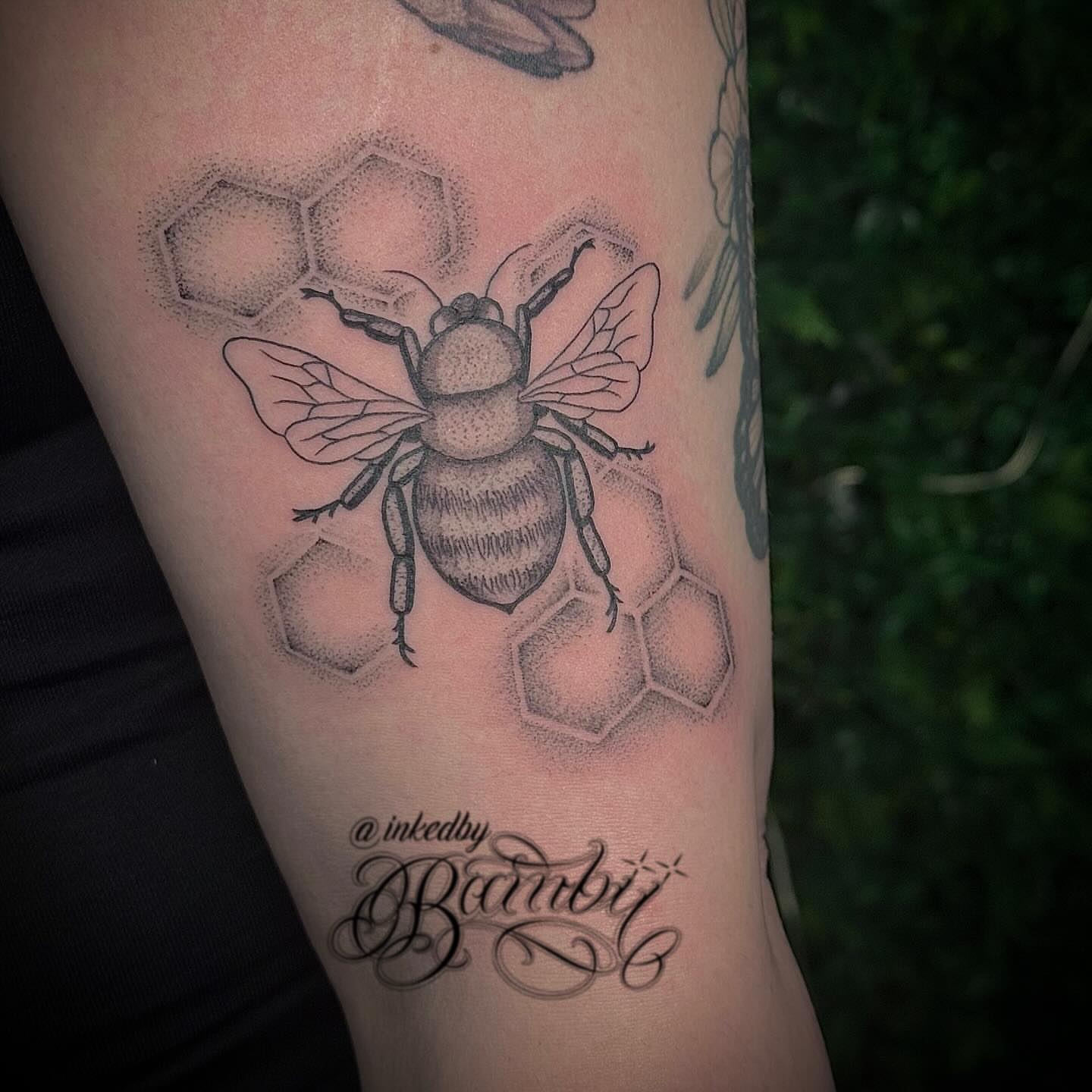 Bee and honeycomb dotwork tattoo on the forearm by Ember