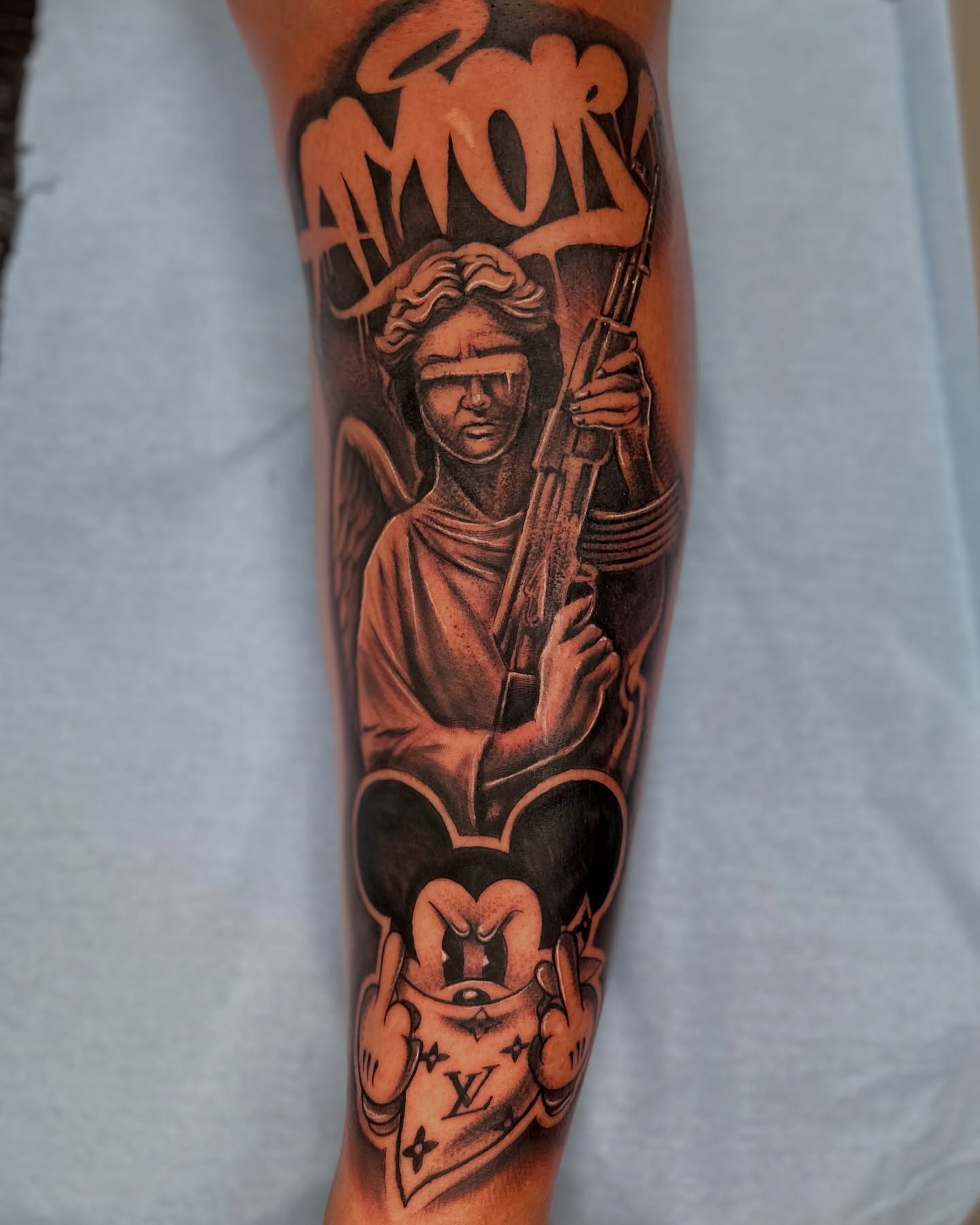 Statue with rifle realism tattoo on the forearm by guinn_art_tatts, Le Moule