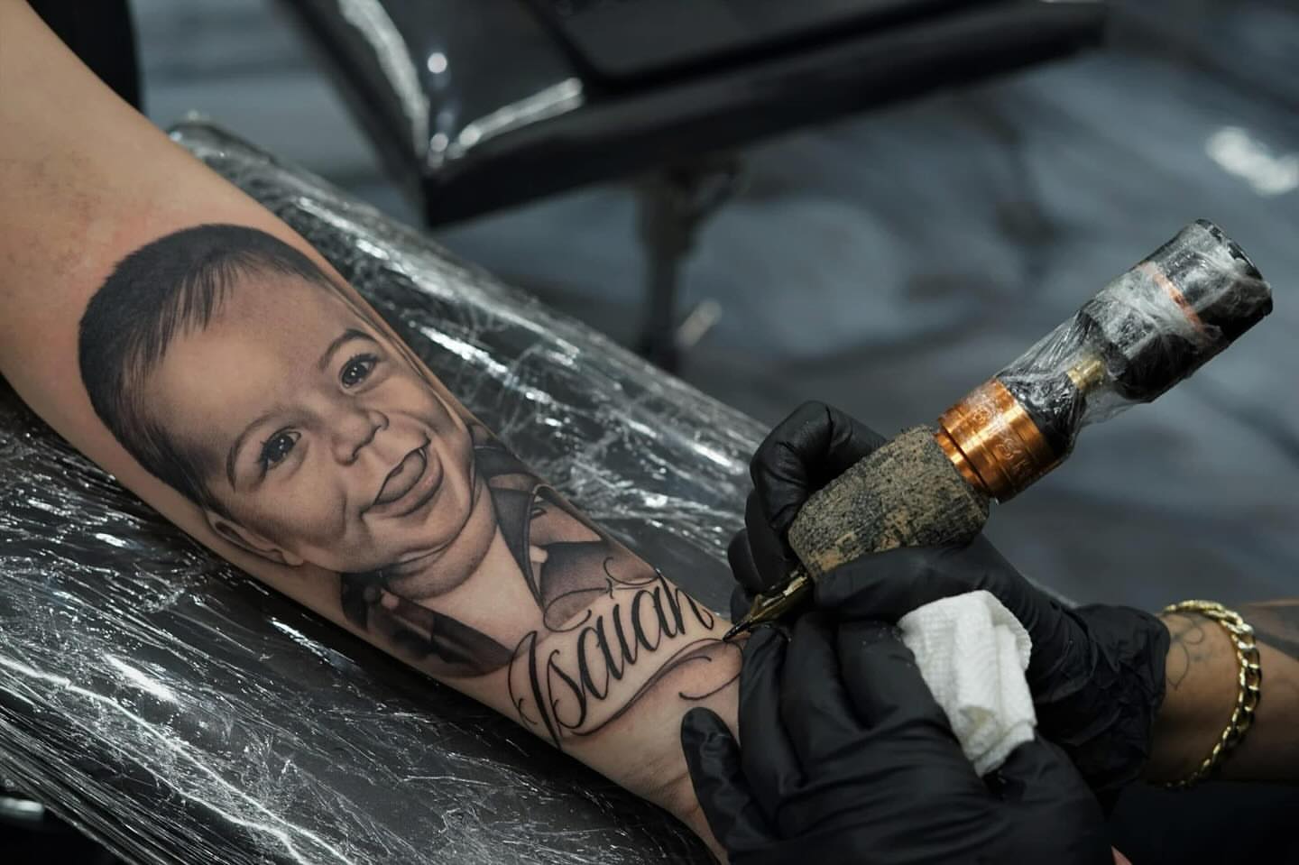 Baby portrait realism tattoo on the forearm by 𝒲𝒾𝓃𝑜𝓃𝒶