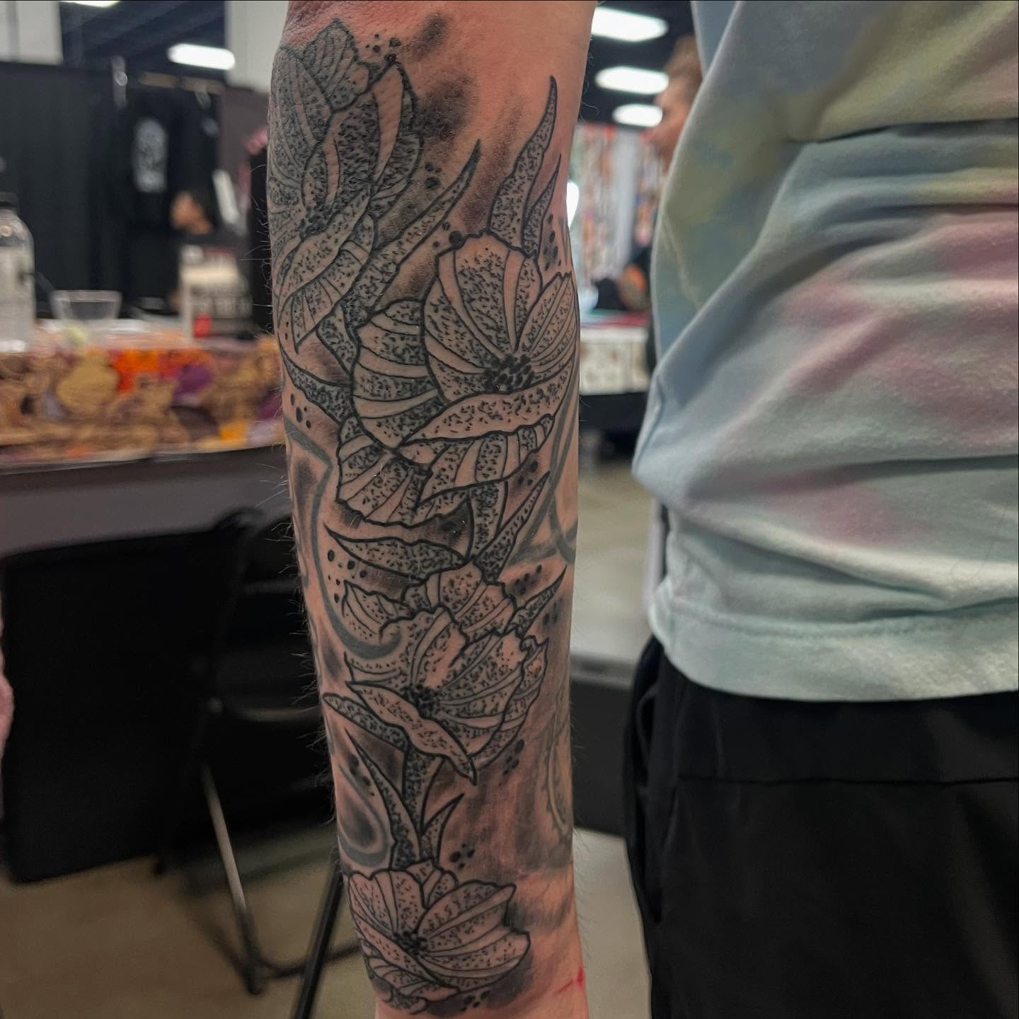 Floral design black and grey tattoo on the forearm by Don Juan