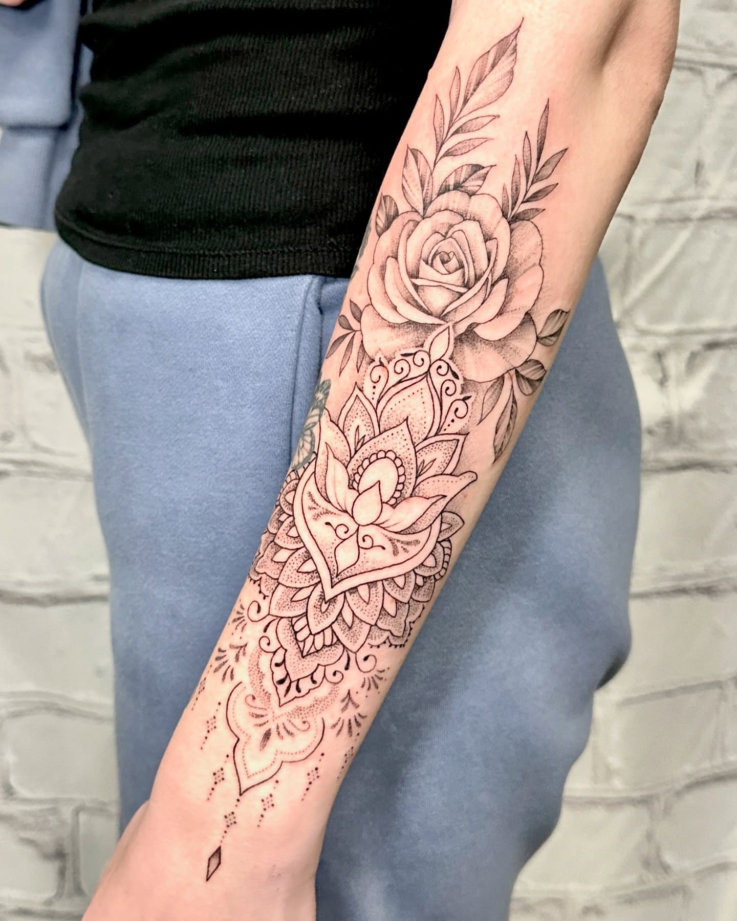 Floral mandala dotwork tattoo on the forearm by Stephen Hansen
