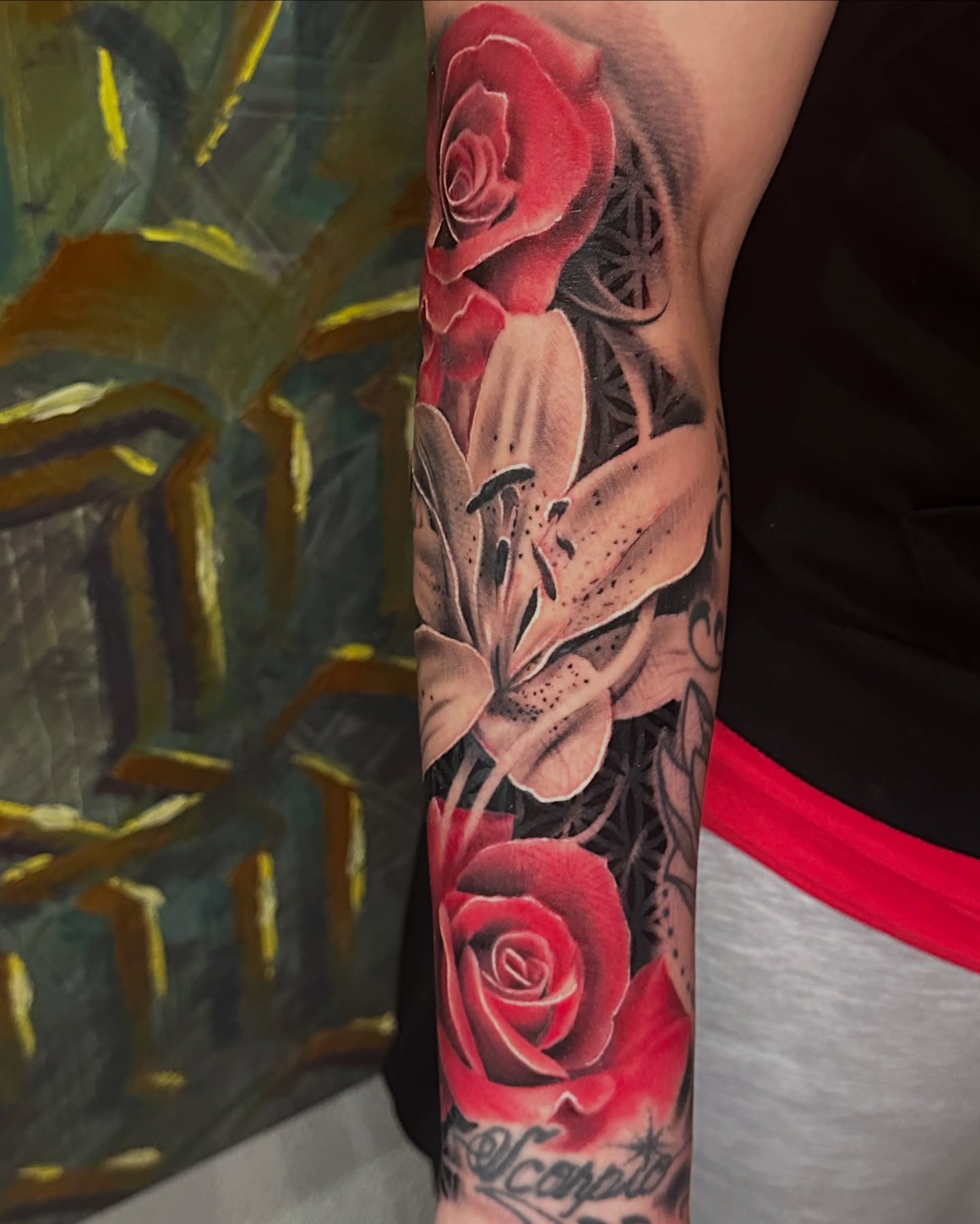 Roses and lilies realism tattoo on the forearm by WestHustleArt
