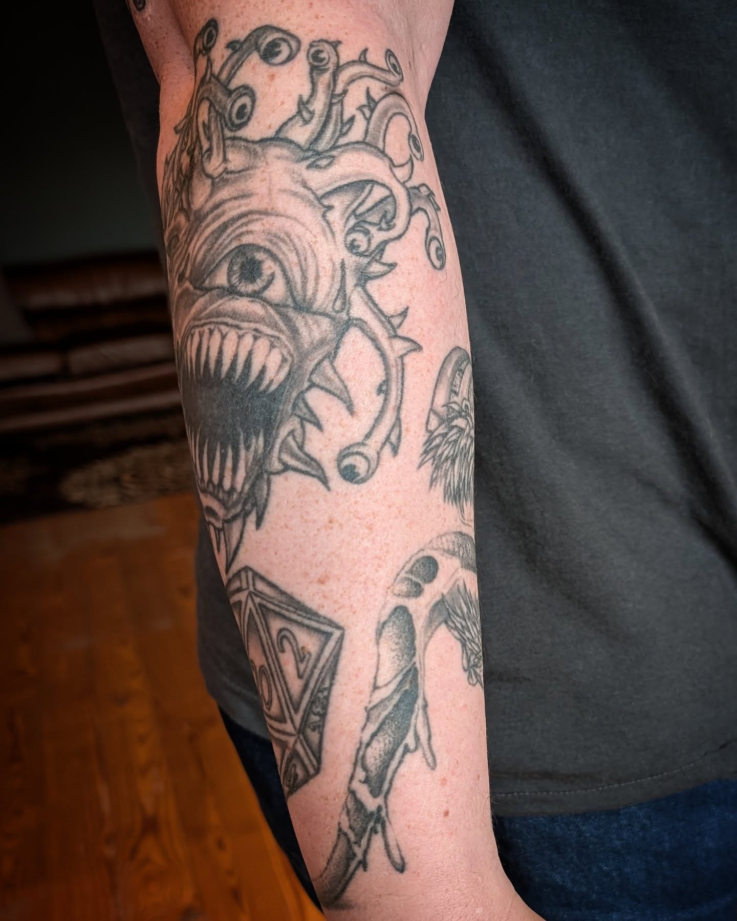 Monster dark realism tattoo on the forearm by Krista Mc