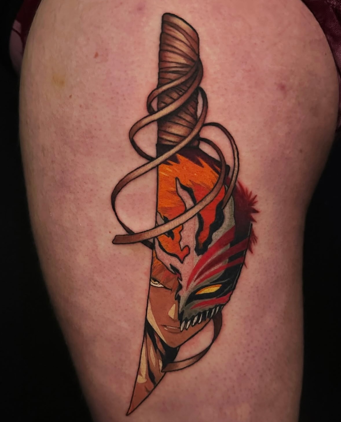 Mask and dagger American traditional tattoo on the thigh by Kelsey Zussman