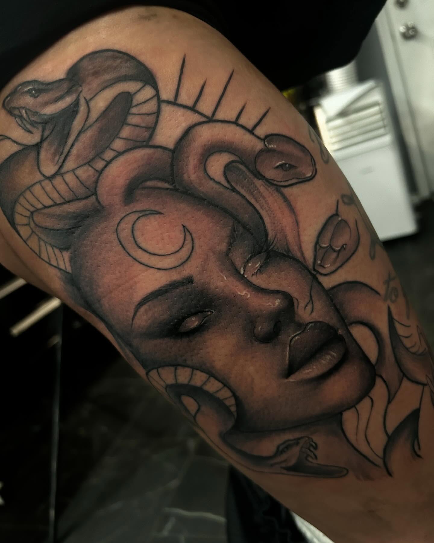 Woman's face with snakes realism tattoo on the forearm by Carlos