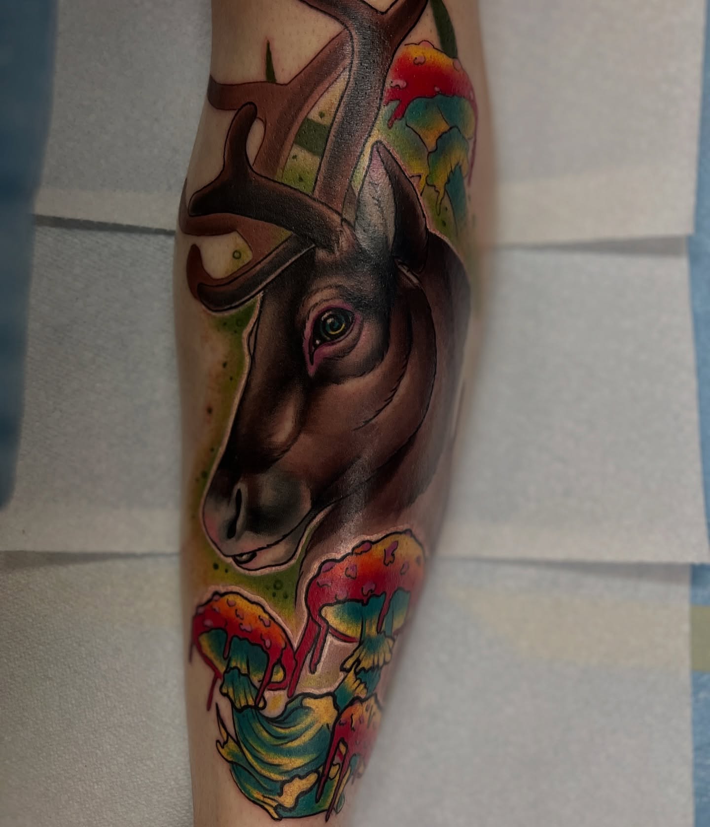 Deer head realism tattoo on the forearm by Emily Walker