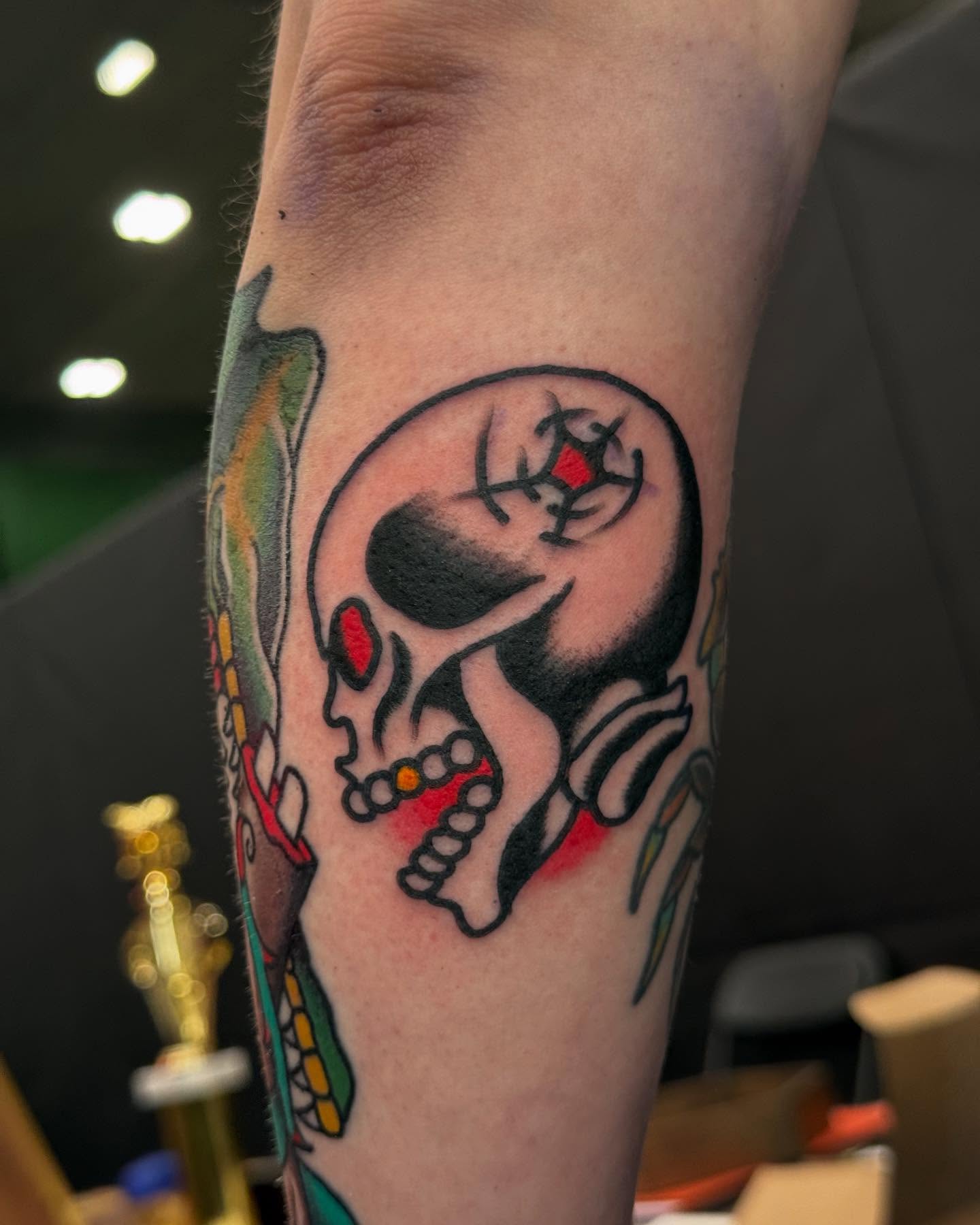 Skull American traditional tattoo on the forearm by Big Al