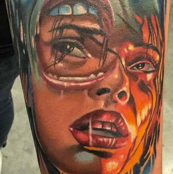 Abstract faces realism tattoo on the forearm by Paul Hicks