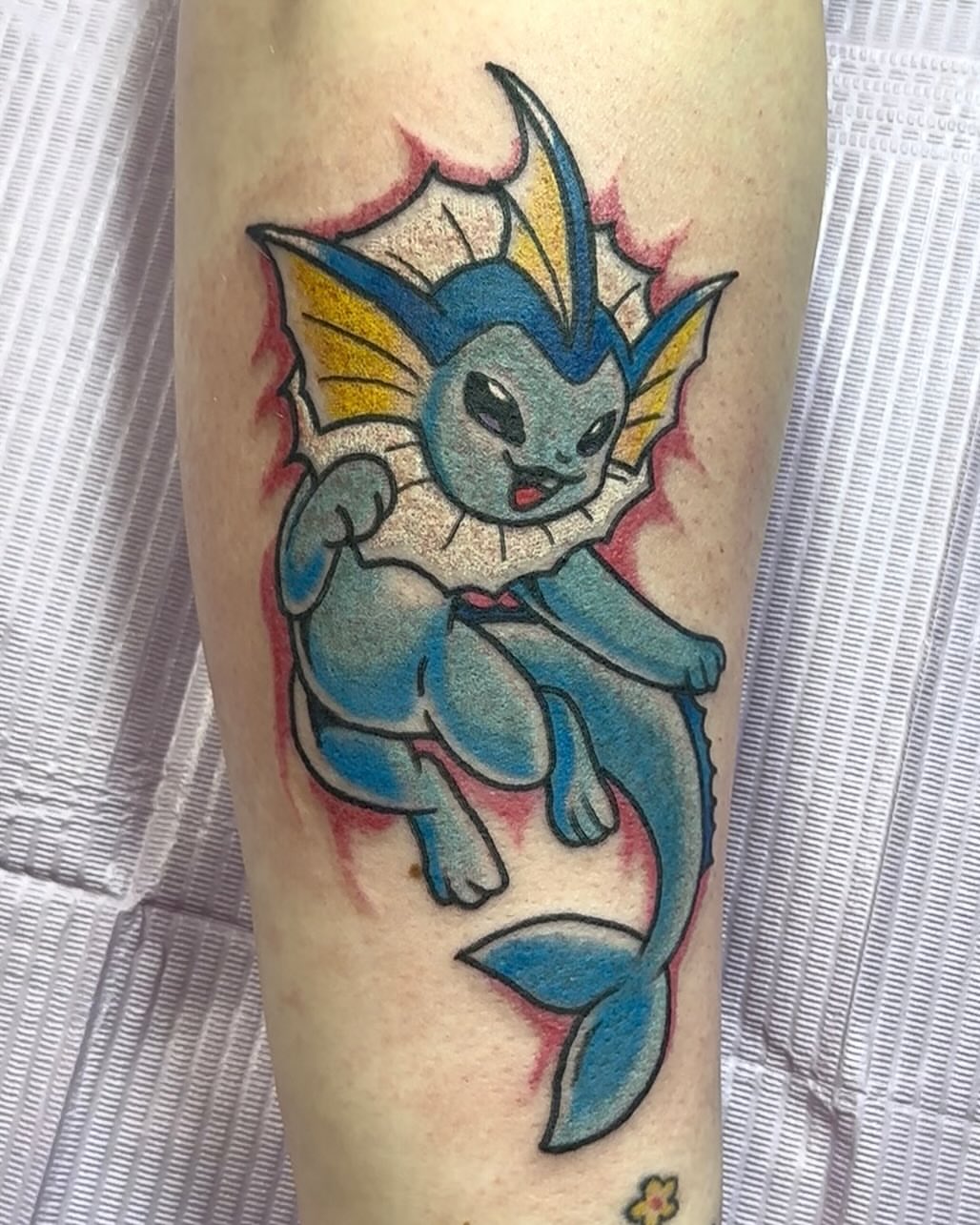 Vaporeon American traditional tattoo on the forearm by Olive Kelley