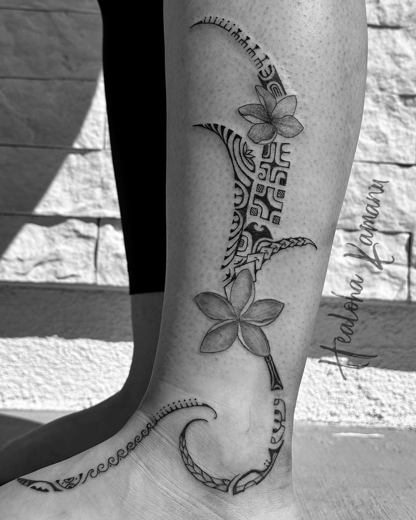 Plumeria flowers and tribal design tribal tattoo on the calf by Healoha “Lindelle” Kamanu
