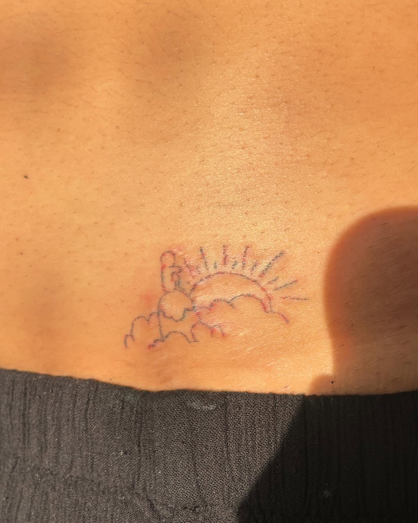 Sun and clouds dotwork tattoo on the back by hana