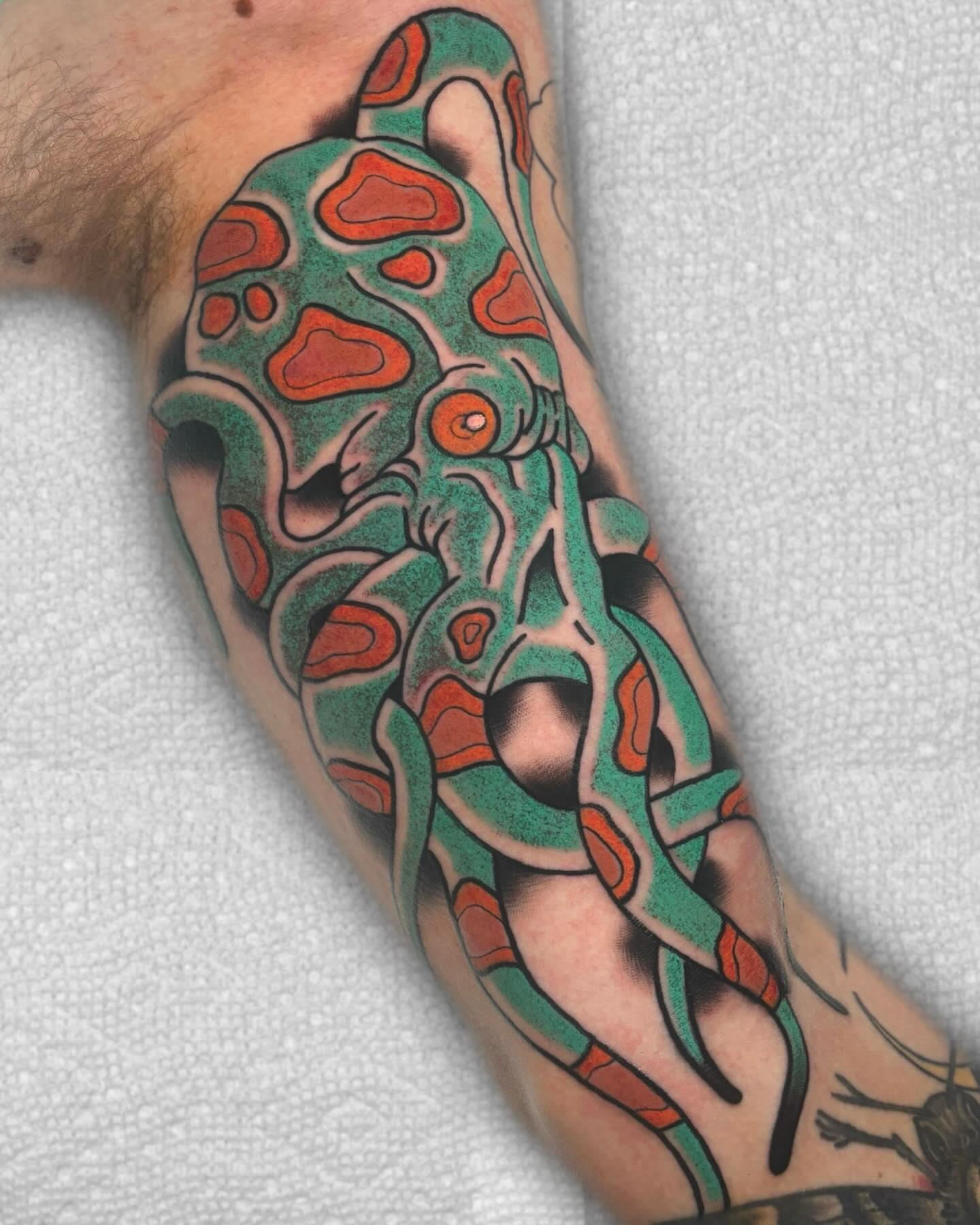 Abstract organic form American traditional tattoo on the forearm by Todd Showdown