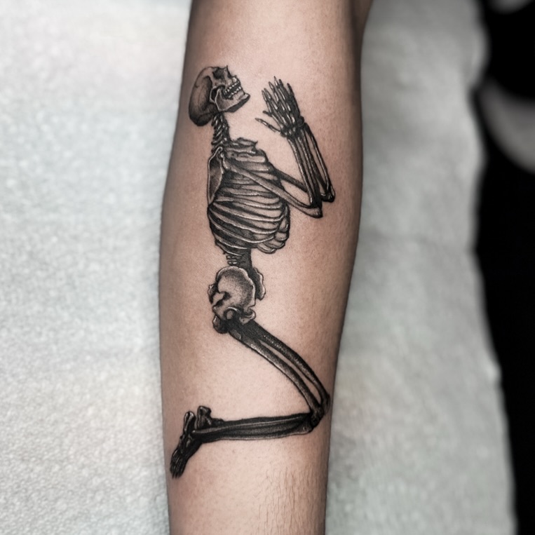 Skeleton dancing black and grey tattoo on the forearm by @sadfoo_tattoo, Austin, Texas