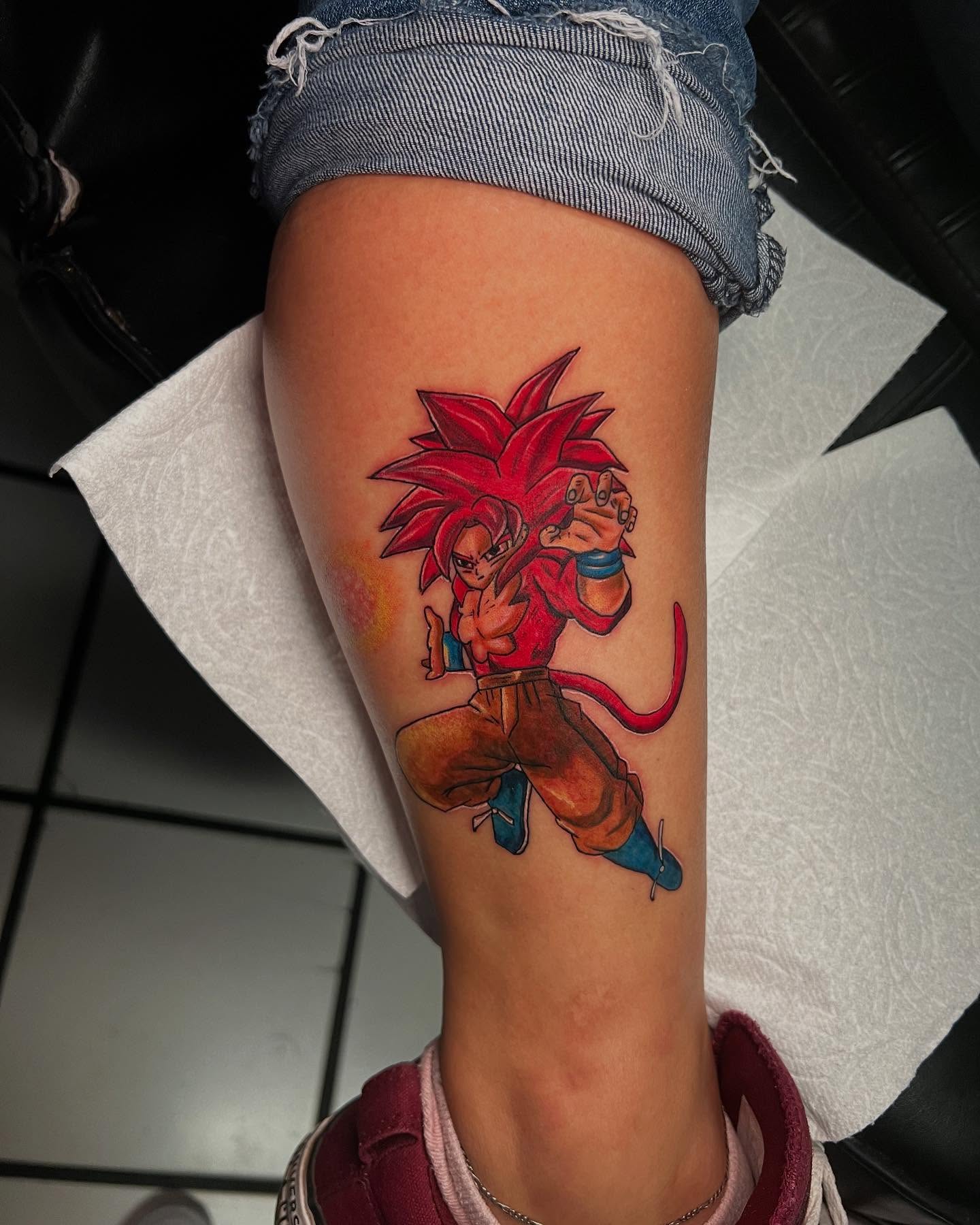 Super saiyan god anime tattoo on the thigh by Jasmin Lozano