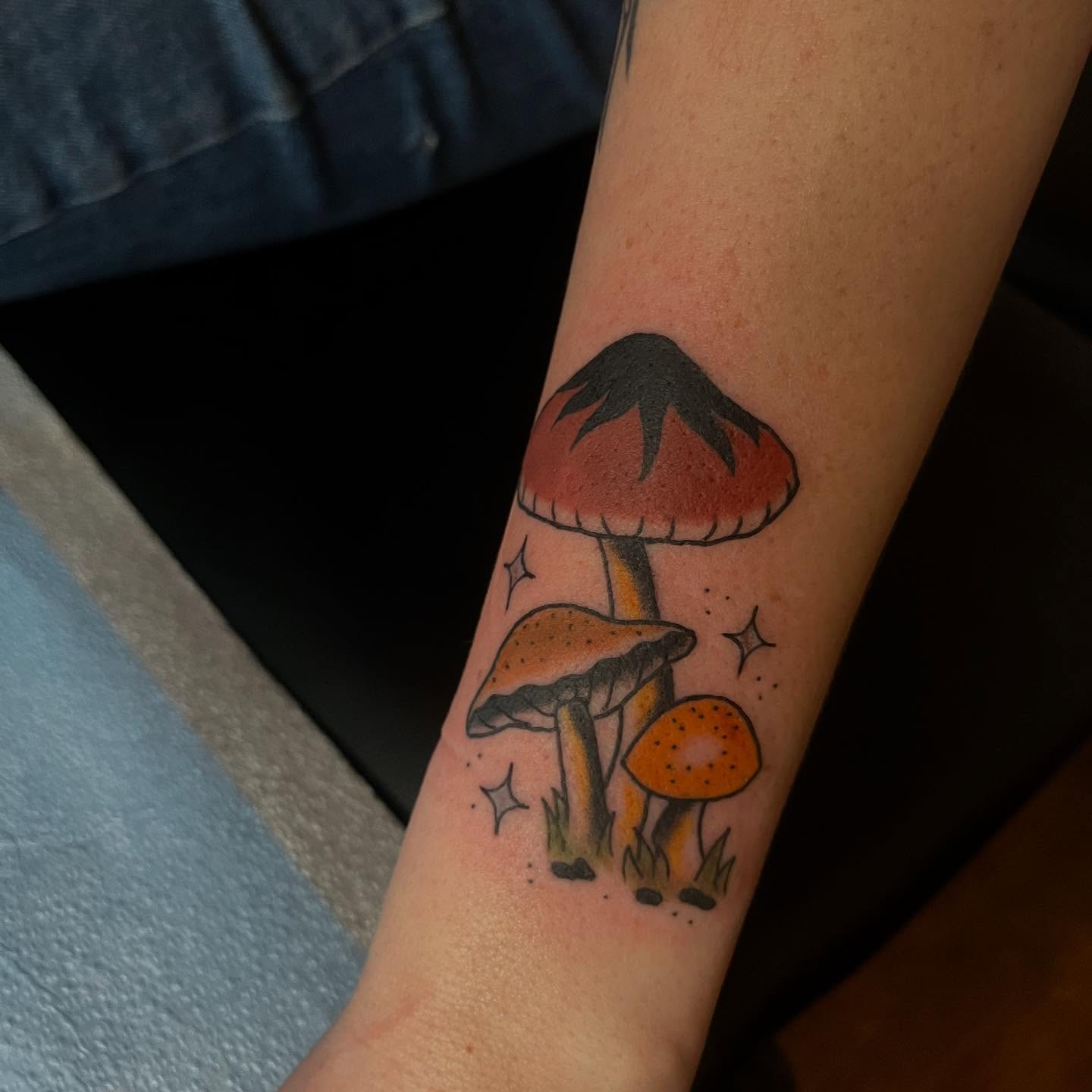Mushrooms dotwork tattoo on the forearm by Mariah Nguyen