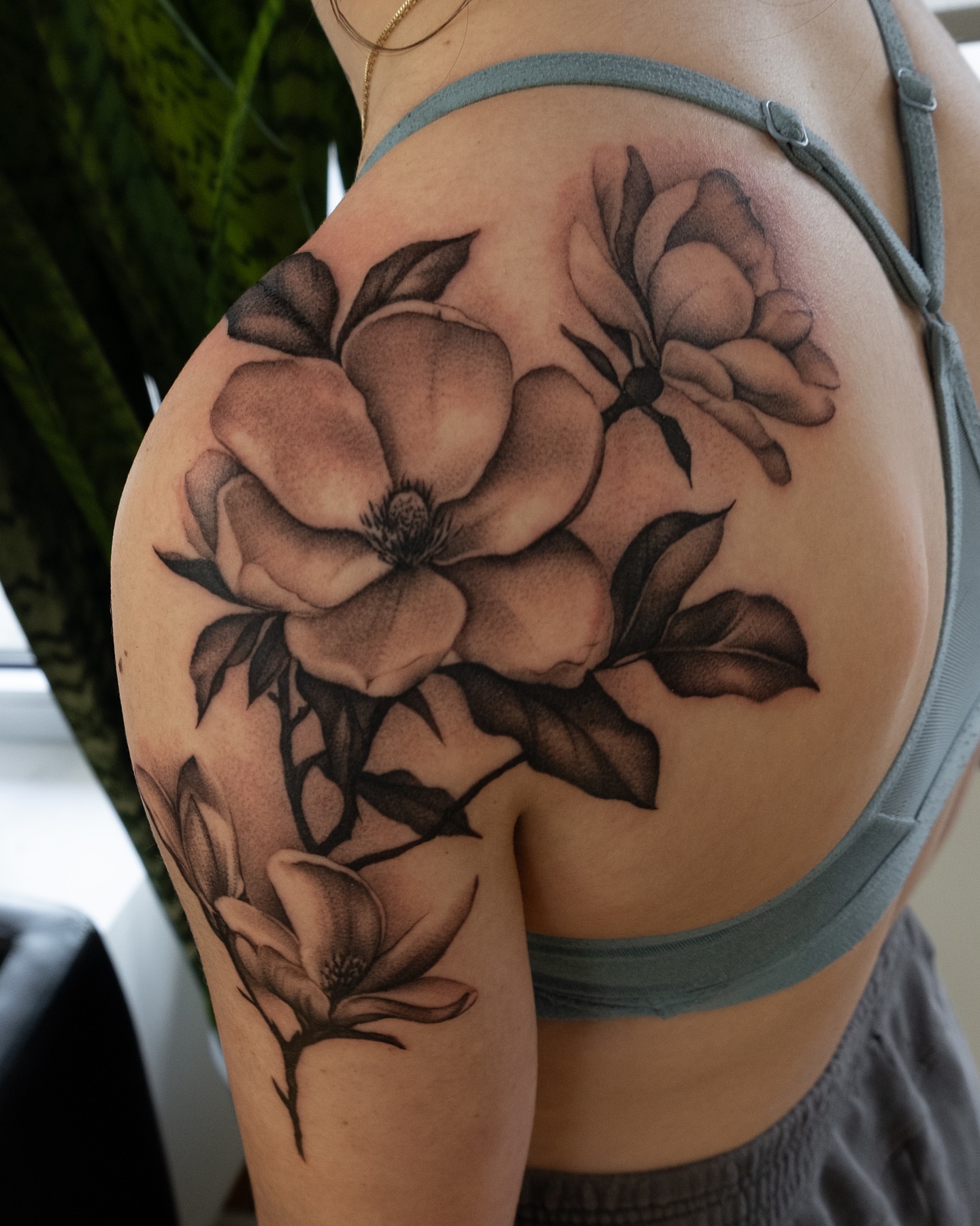Magnolia flowers black and grey tattoo on the shoulder by Ohio Tattoo Artist - Tehya Maxwell, Springfield, Ohio