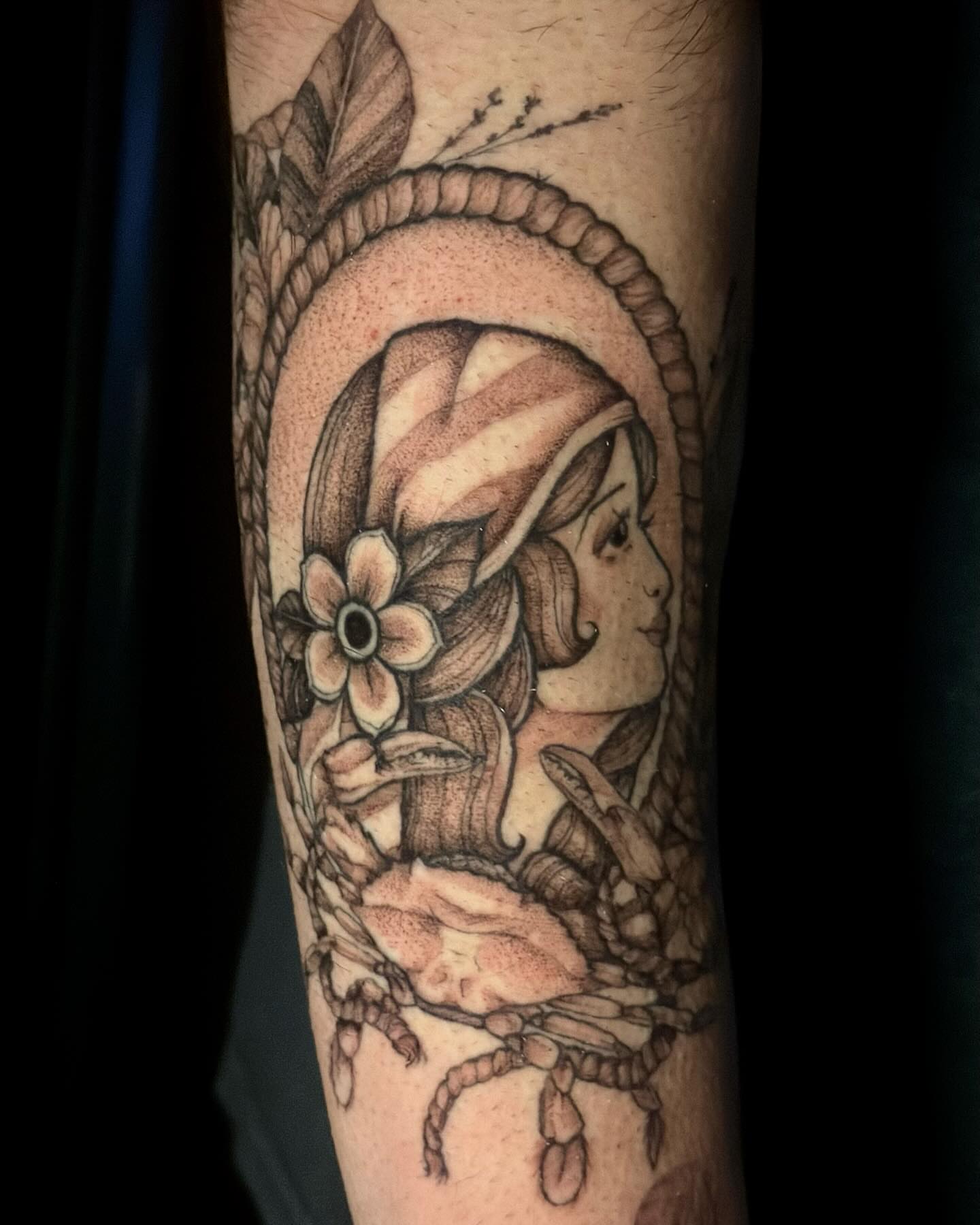 Woman with flowers black and grey tattoo on the forearm by Sabrina, Harrison, New Jersey