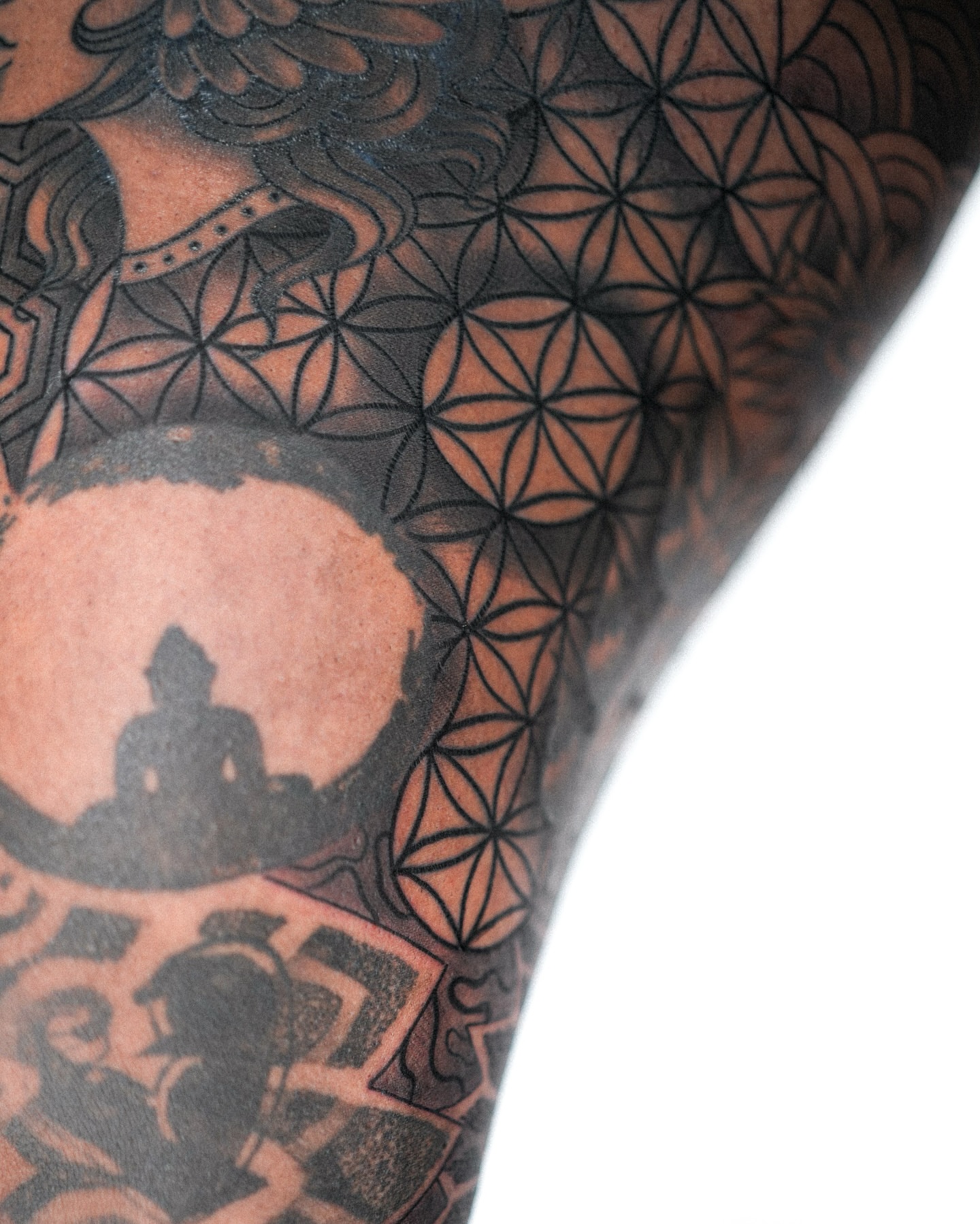 Geometric patterns geometric tattoo on the upper arm by Eric Hare