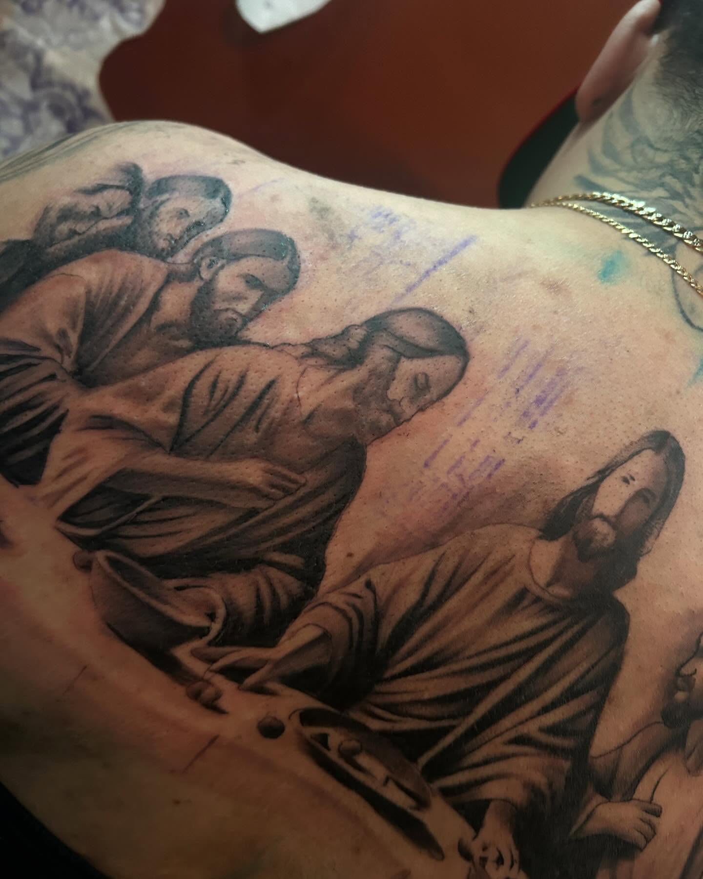 Religious scene realism tattoo on the back by Carlos