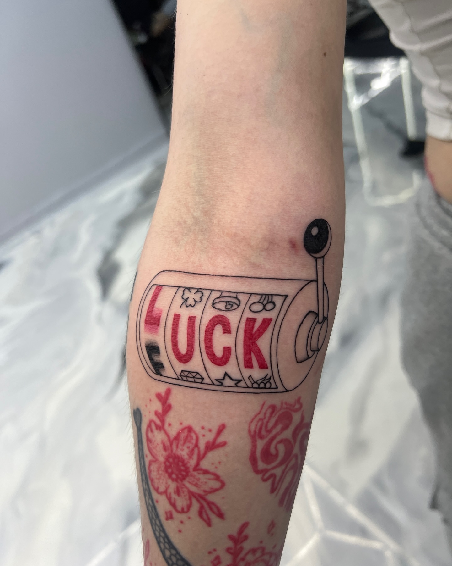 Slot machine American traditional tattoo on the forearm by Eyekonic Ink