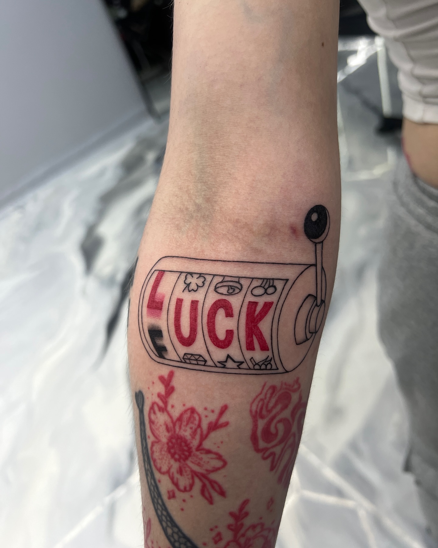 Slot machine American traditional tattoo on the forearm by Eyekonic Ink