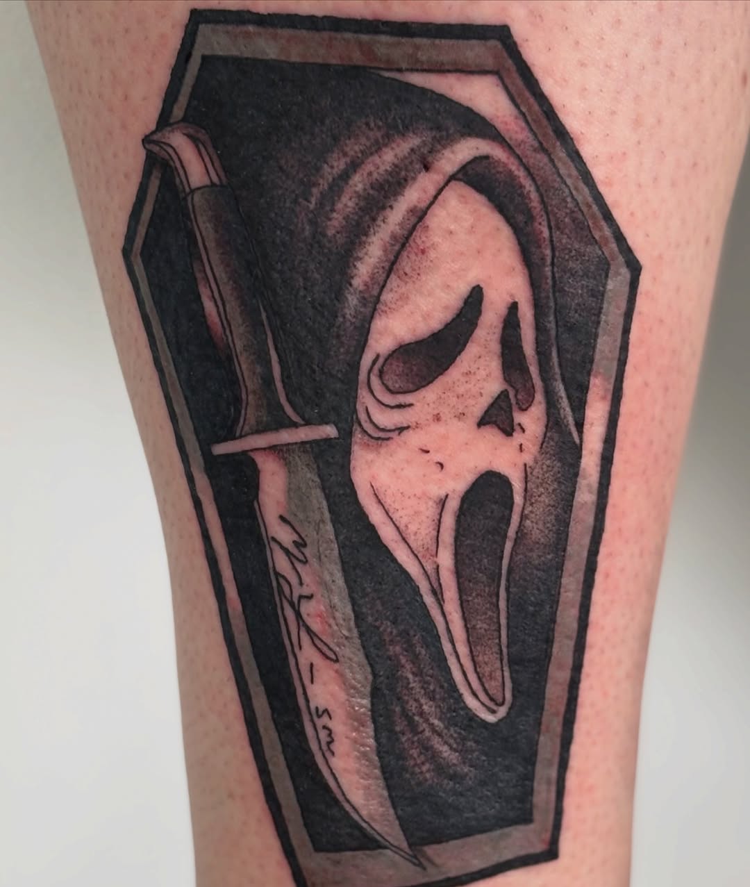 Ghostface mask and knife realism tattoo on the forearm by Sterling Paris