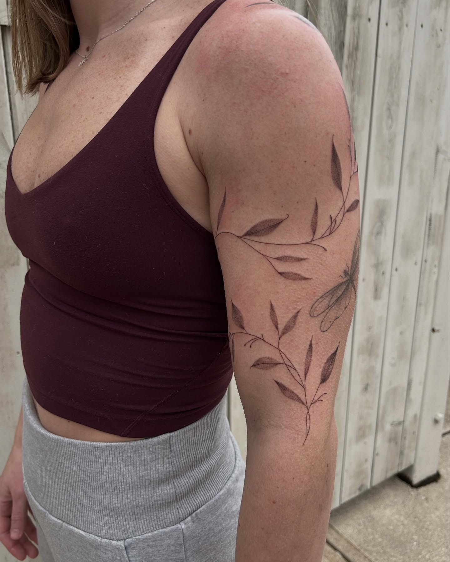 Botanical black and grey tattoo on the forearm by Kennedy Ramey
