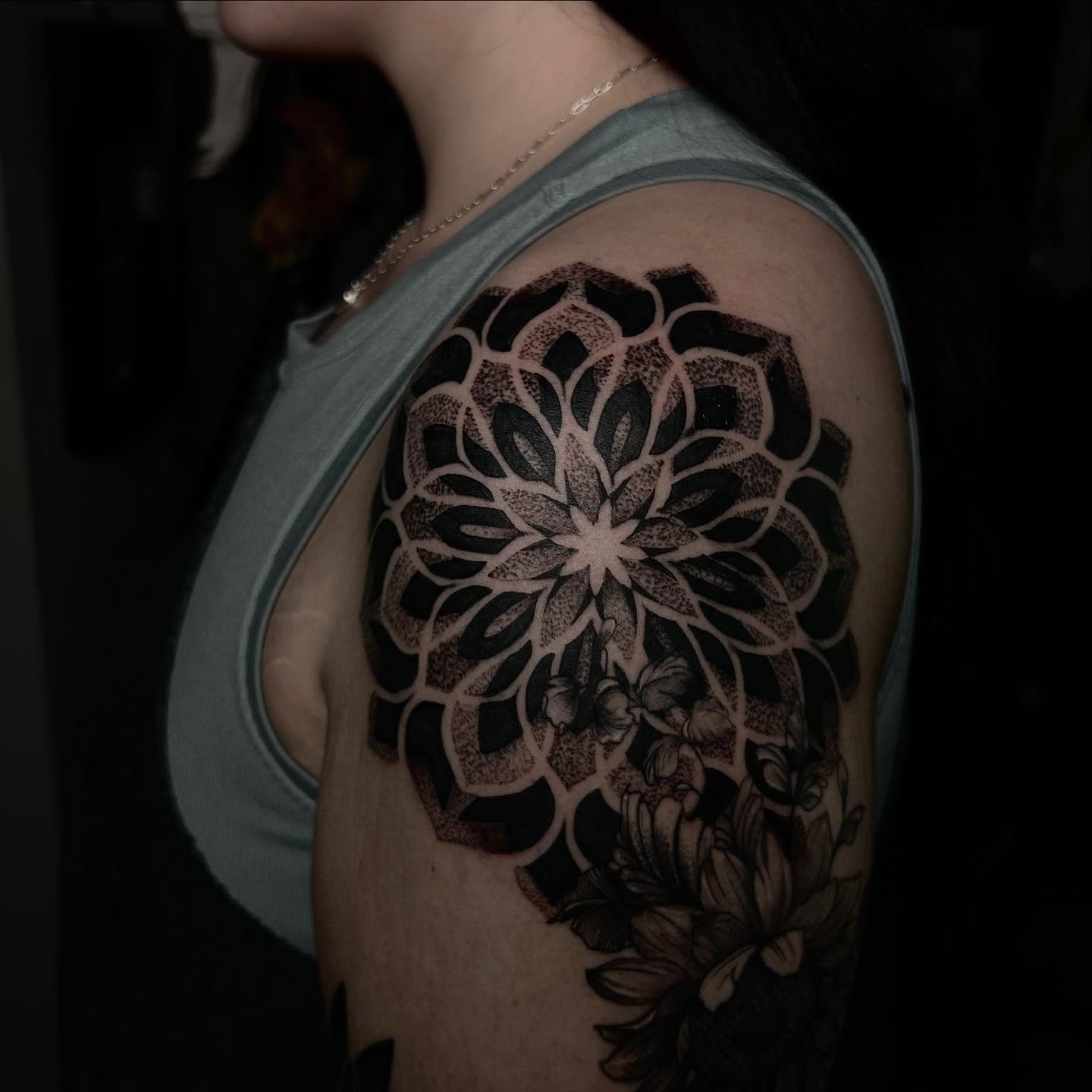 Flower dotwork tattoo on the shoulder by Jelly