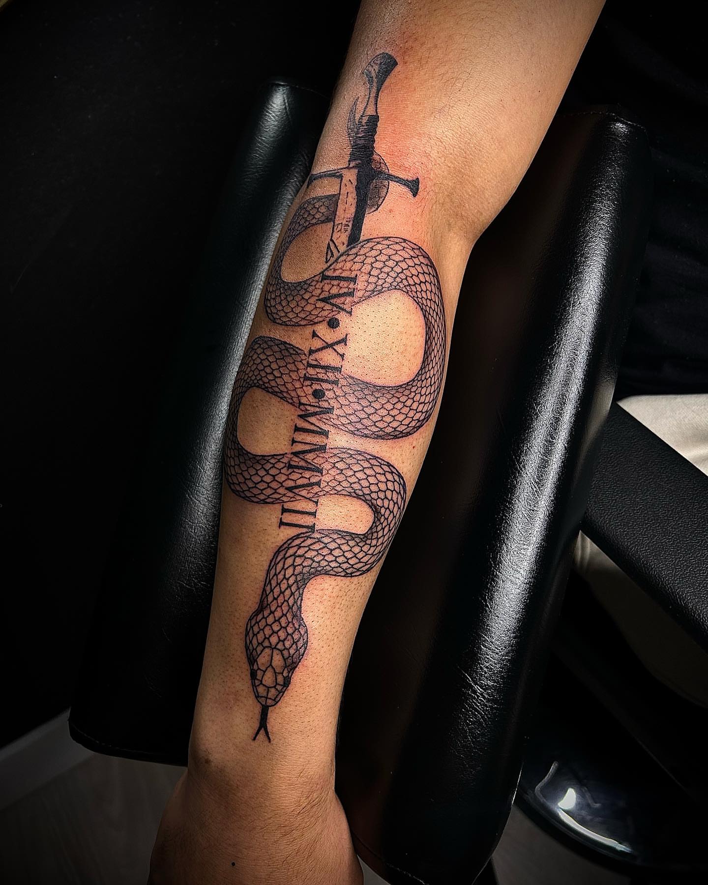 Snake and sword realism tattoo on the forearm by Cleveland Tattoo Artist, Cleveland, Ohio