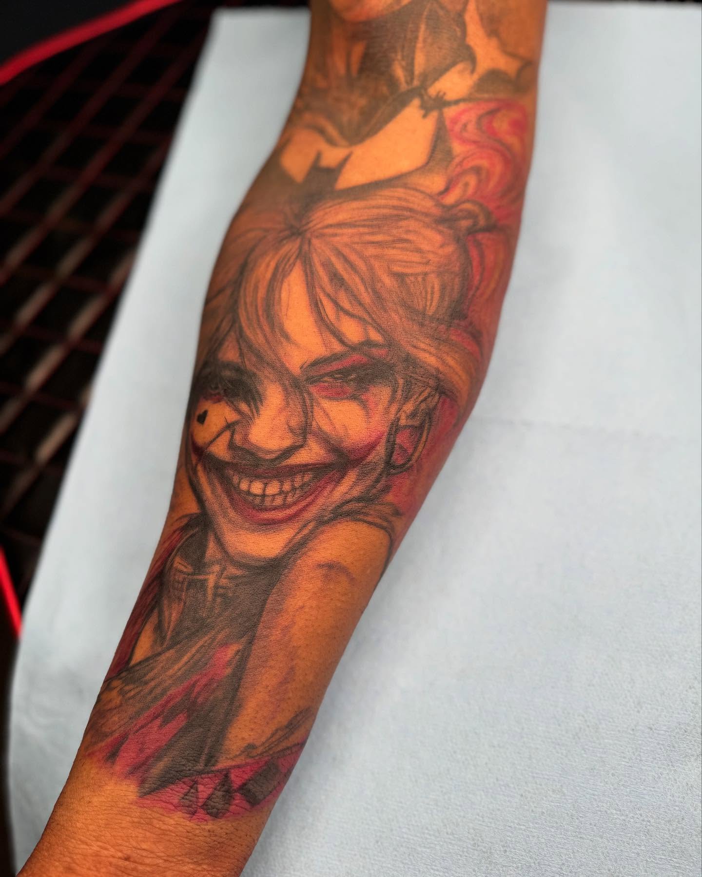 Joker realism tattoo on the forearm by @inkhazmat