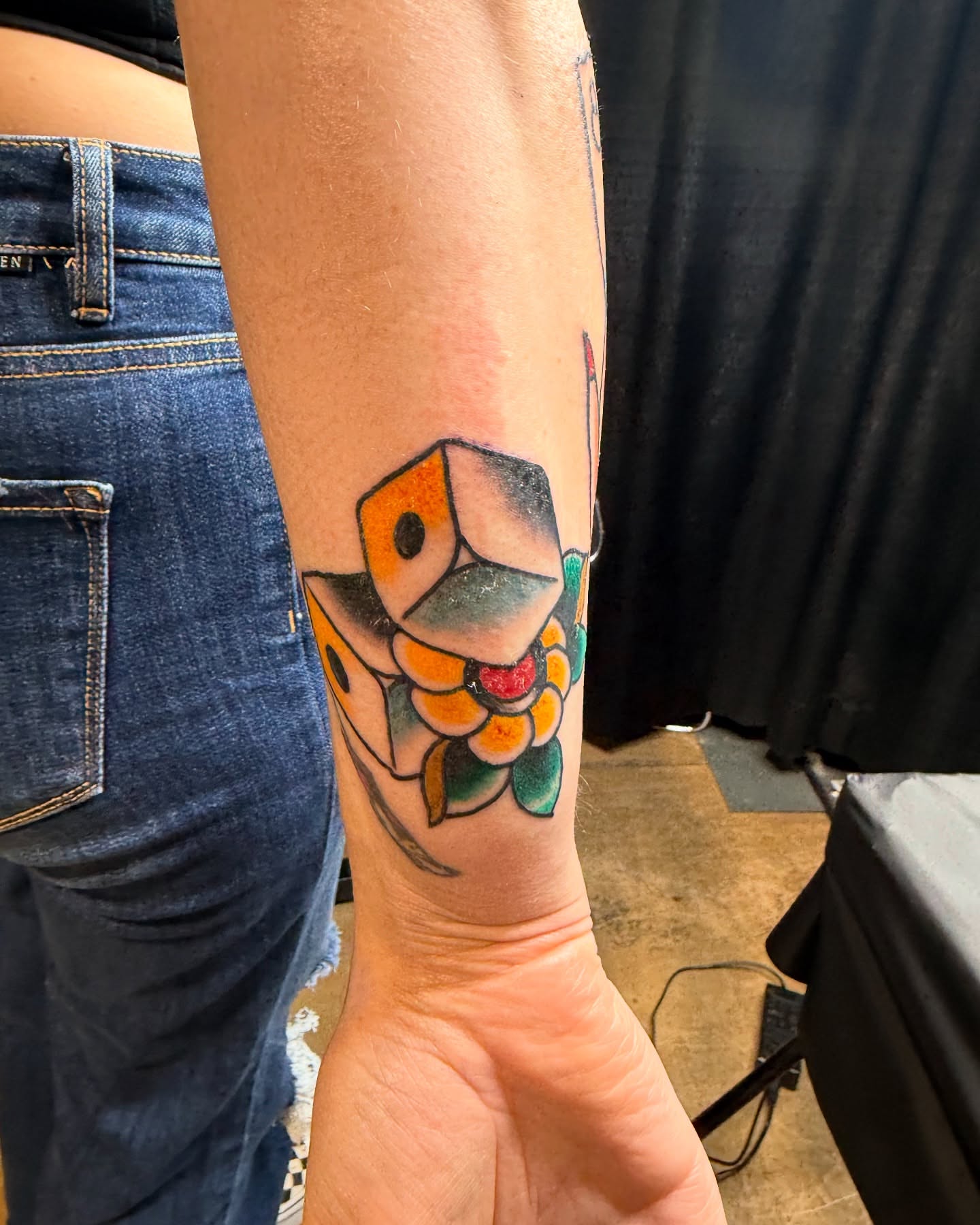 Cube with flowers geometric tattoo on the forearm by DemianThompson