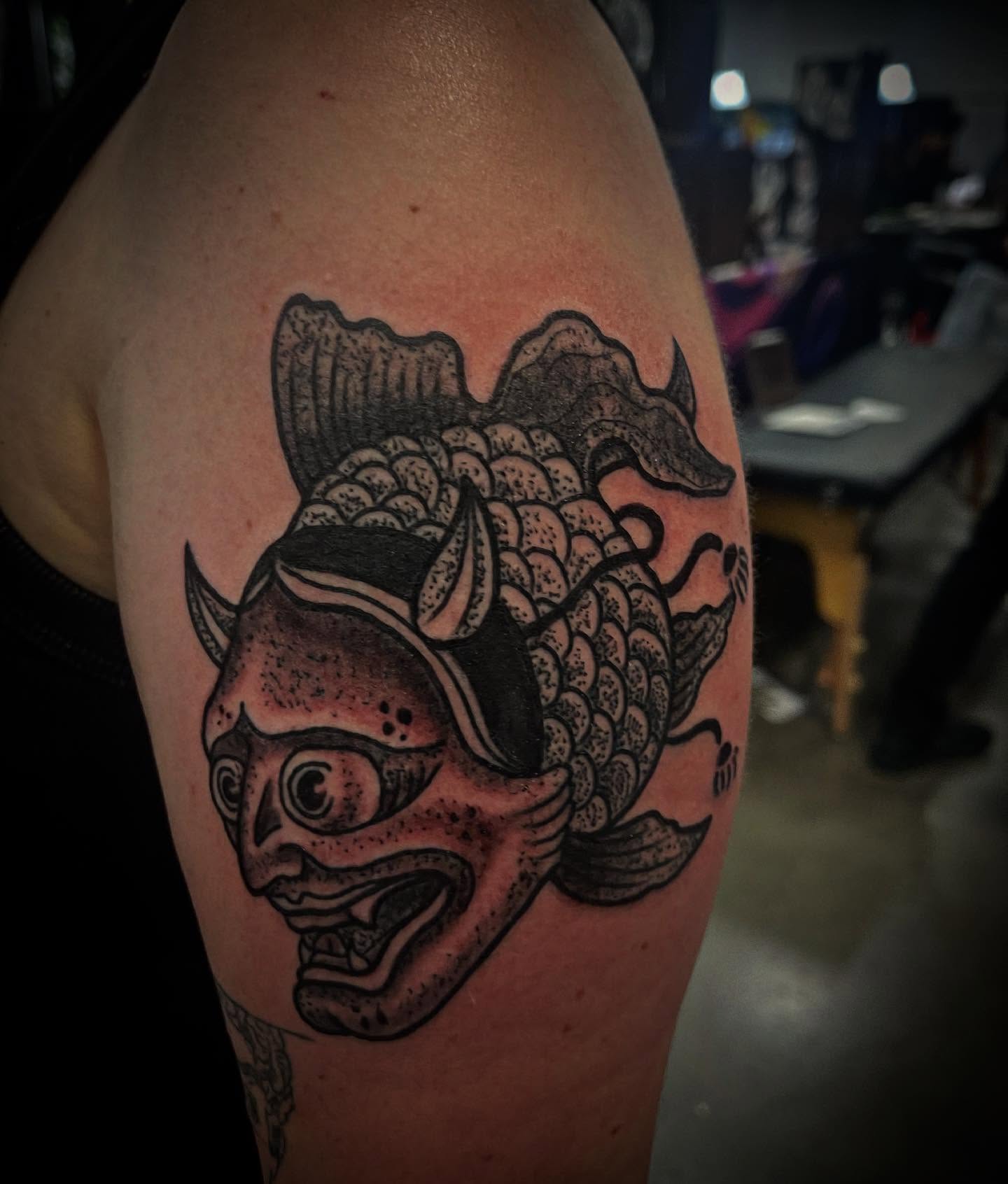 Koi fish japanese irezumi tattoo on the upper arm by Don Juan