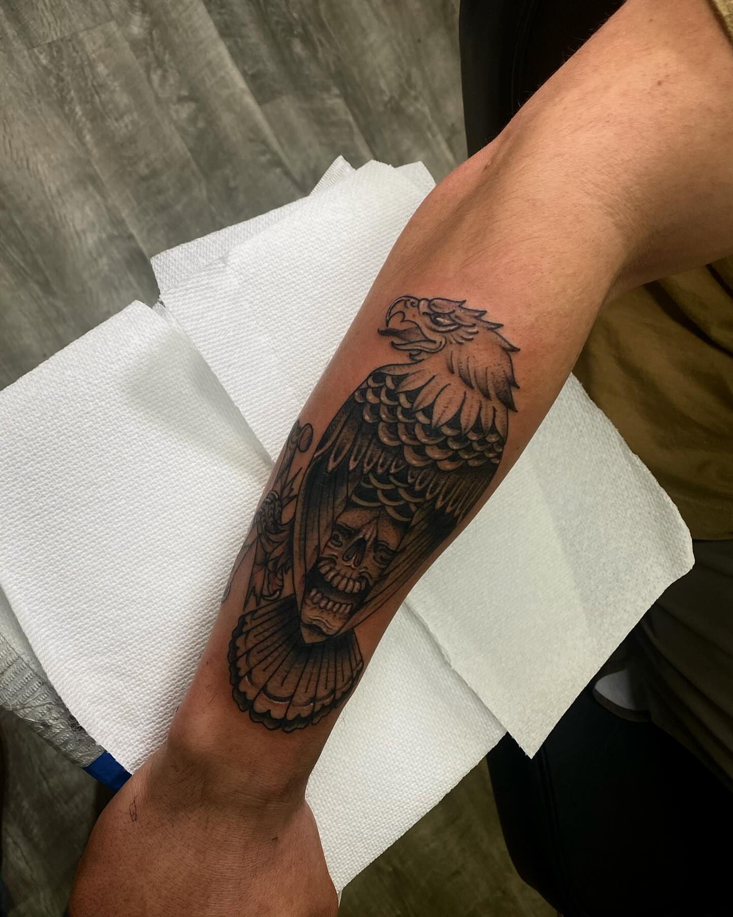 Eagle and skull black and grey tattoo on the forearm by Chase Skylar Clayton Ogle
