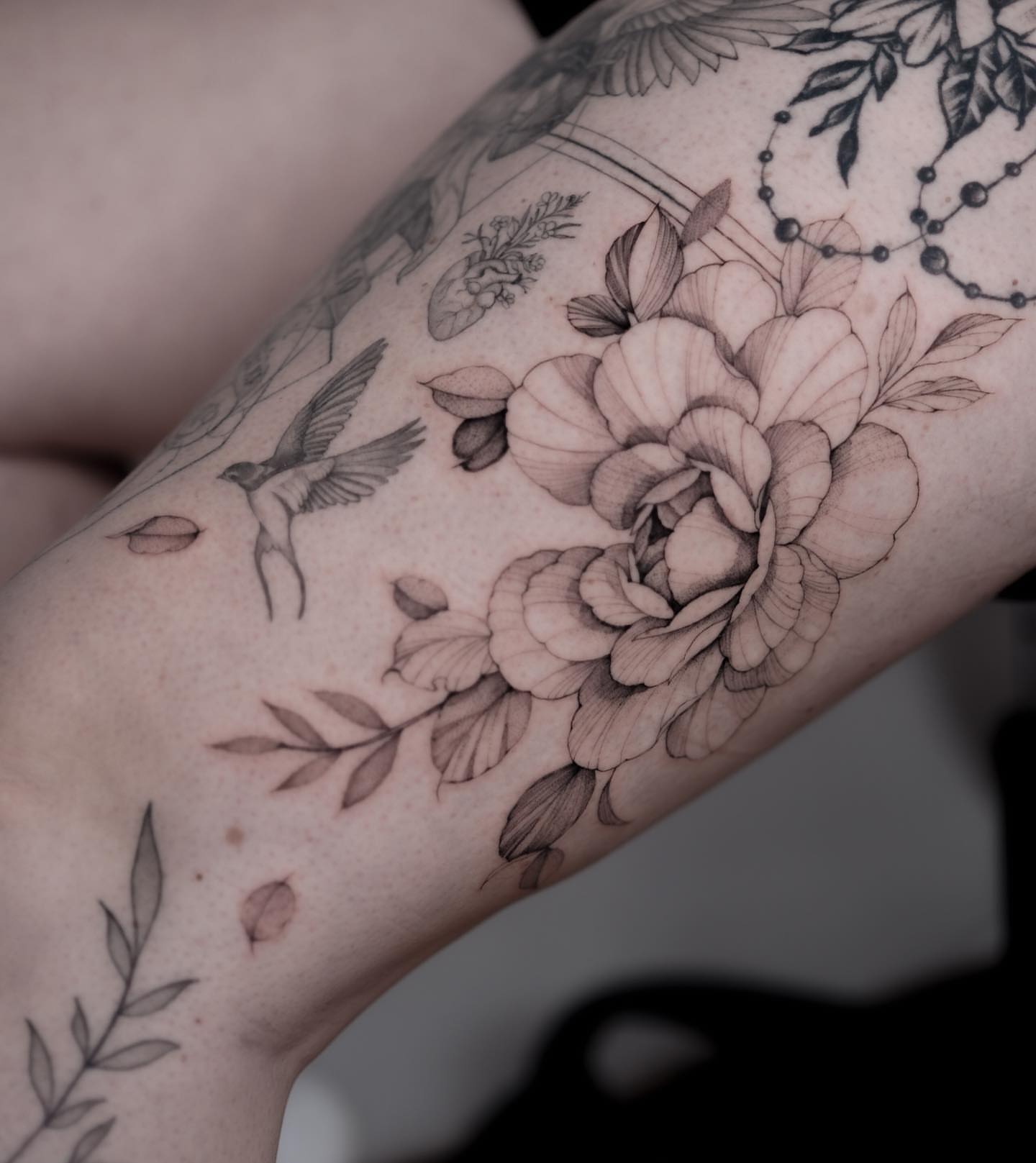 Floral bouquet realism tattoo on the forearm by Tattoo artist in Boston