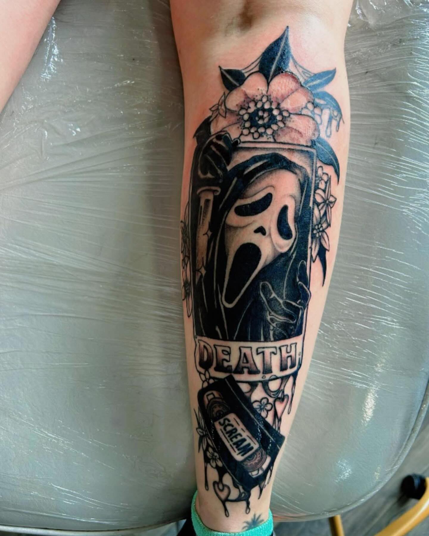 Ghost mask dark realism tattoo on the forearm by Haley Winfree