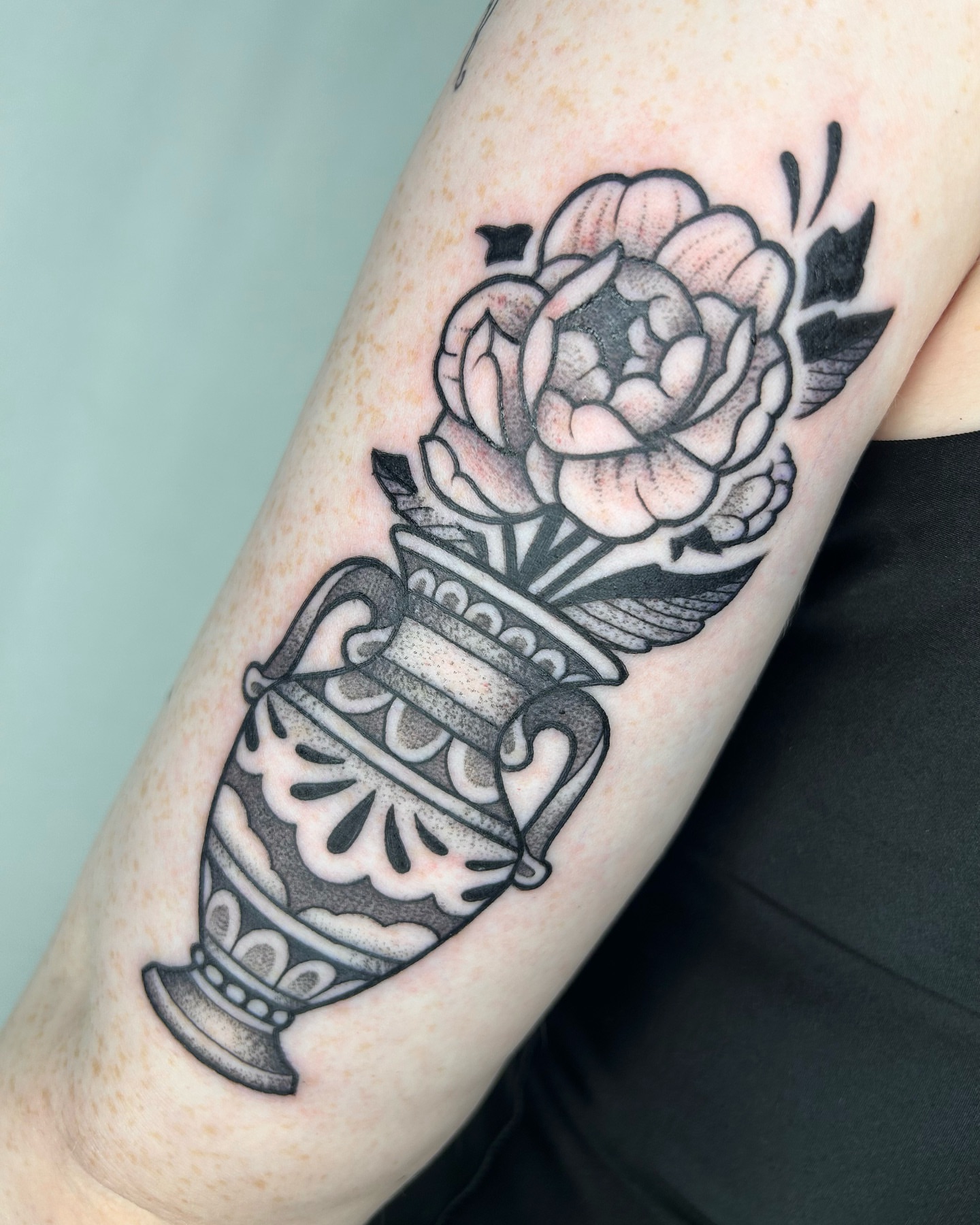 Vase and rose black and grey tattoo on the forearm by Aaron Murray ✨ Michigan Tattoo Artist