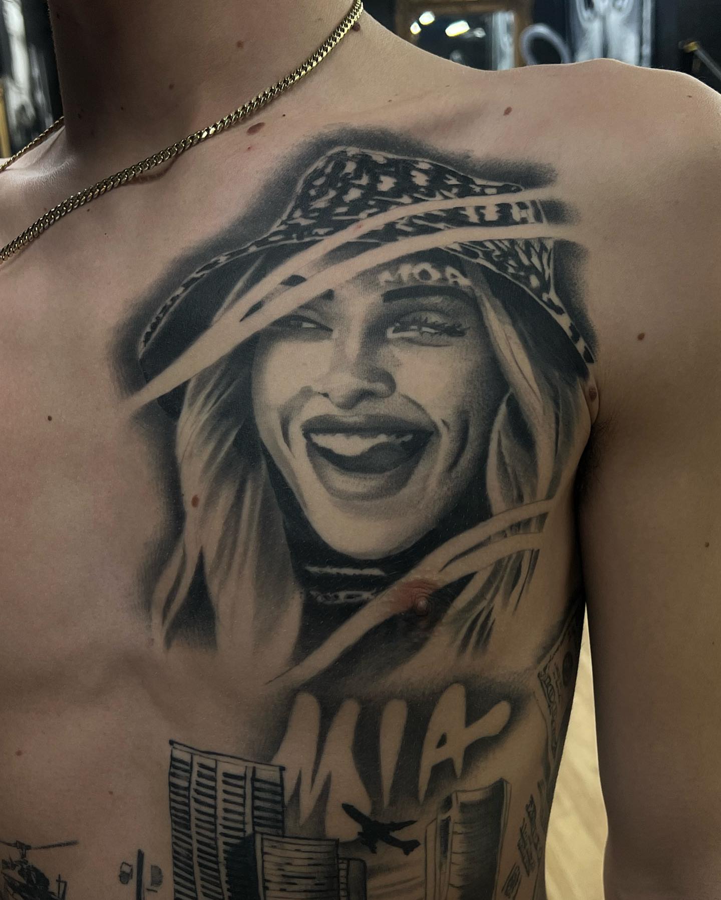 Portrait of a woman realism tattoo on the chest by Lemaih Gonzalez