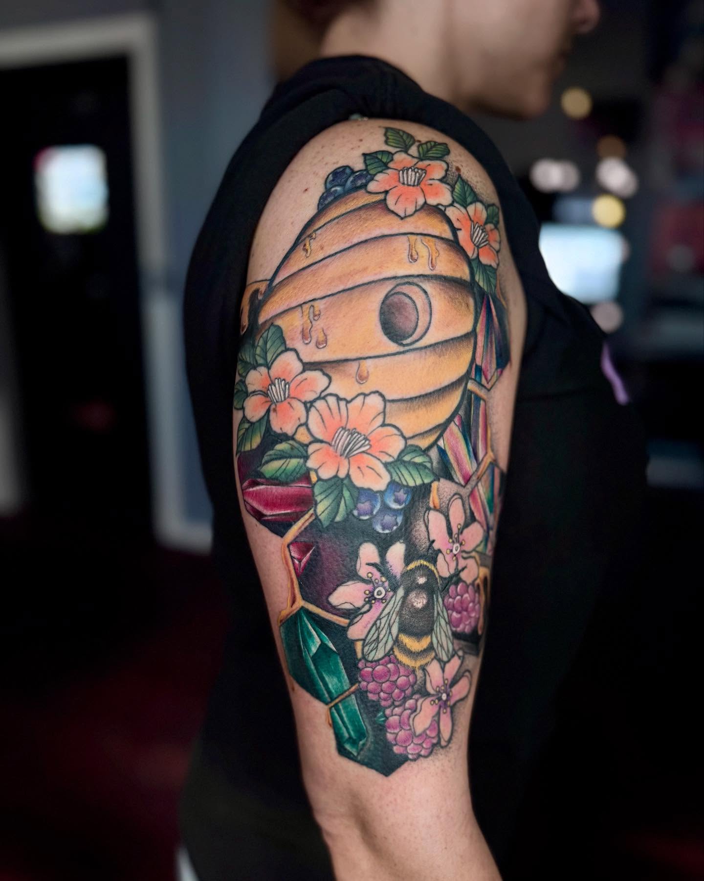 Bee hive and flowers American traditional tattoo on the forearm by Stephanie Cruz, Kansas City, Missouri