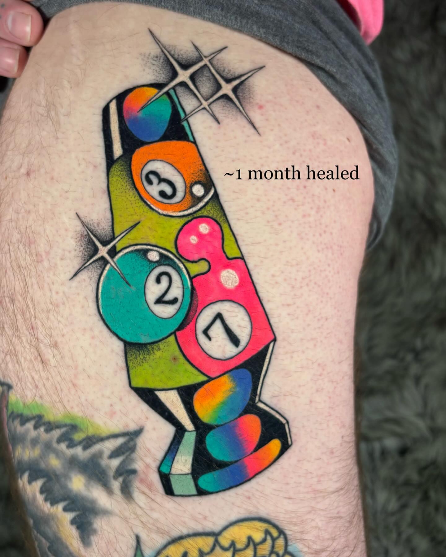 Billiard balls dotwork tattoo on the thigh by Carly Zehring