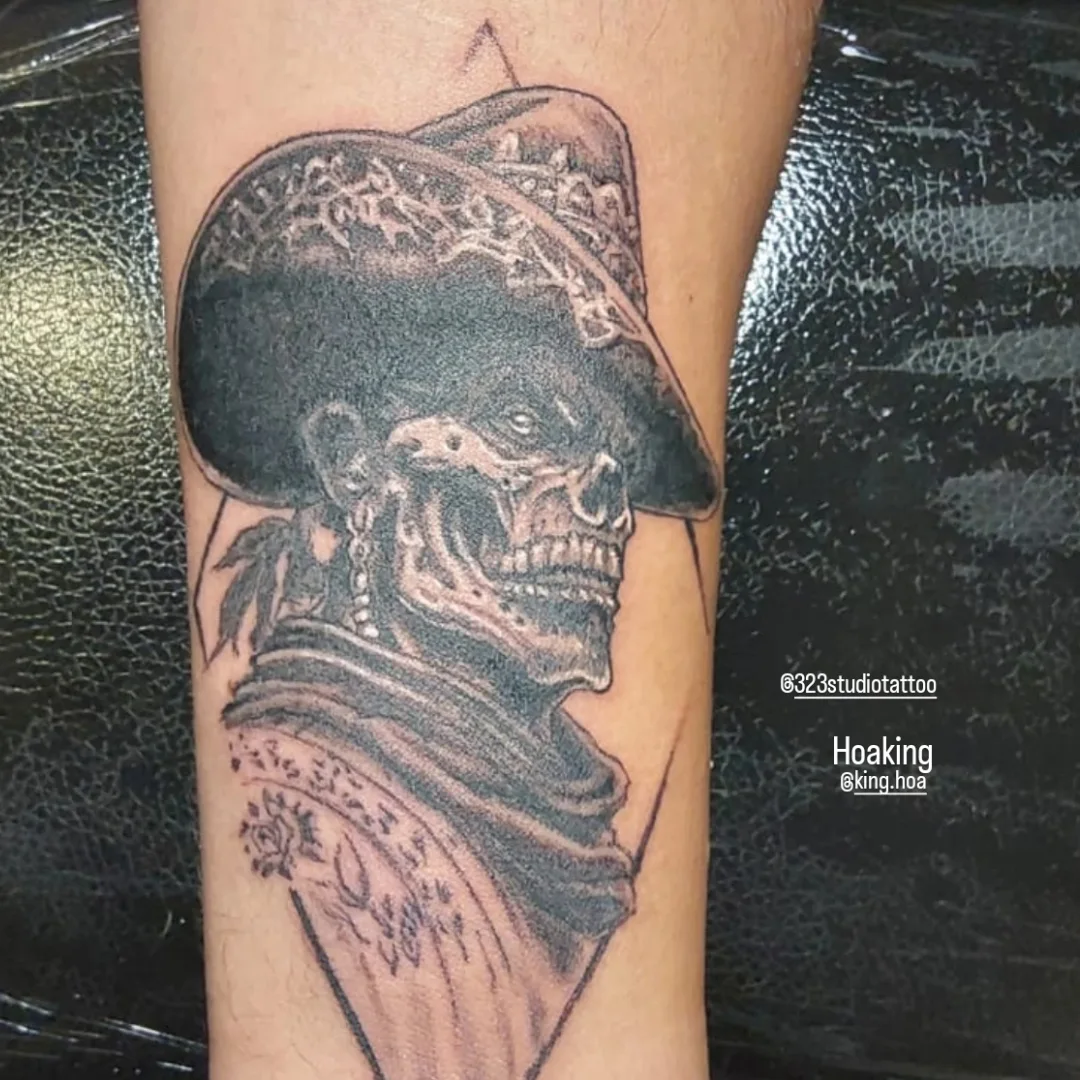 Skull wearing sombrero realism tattoo on the forearm by Hoa King