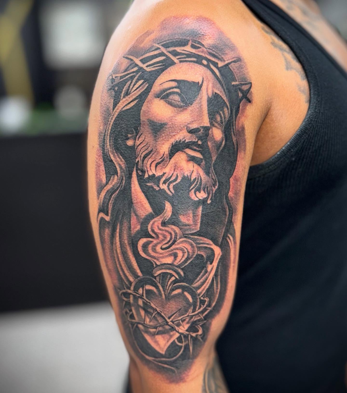Jesus Christ realism tattoo on the shoulder by Christopher McGlone