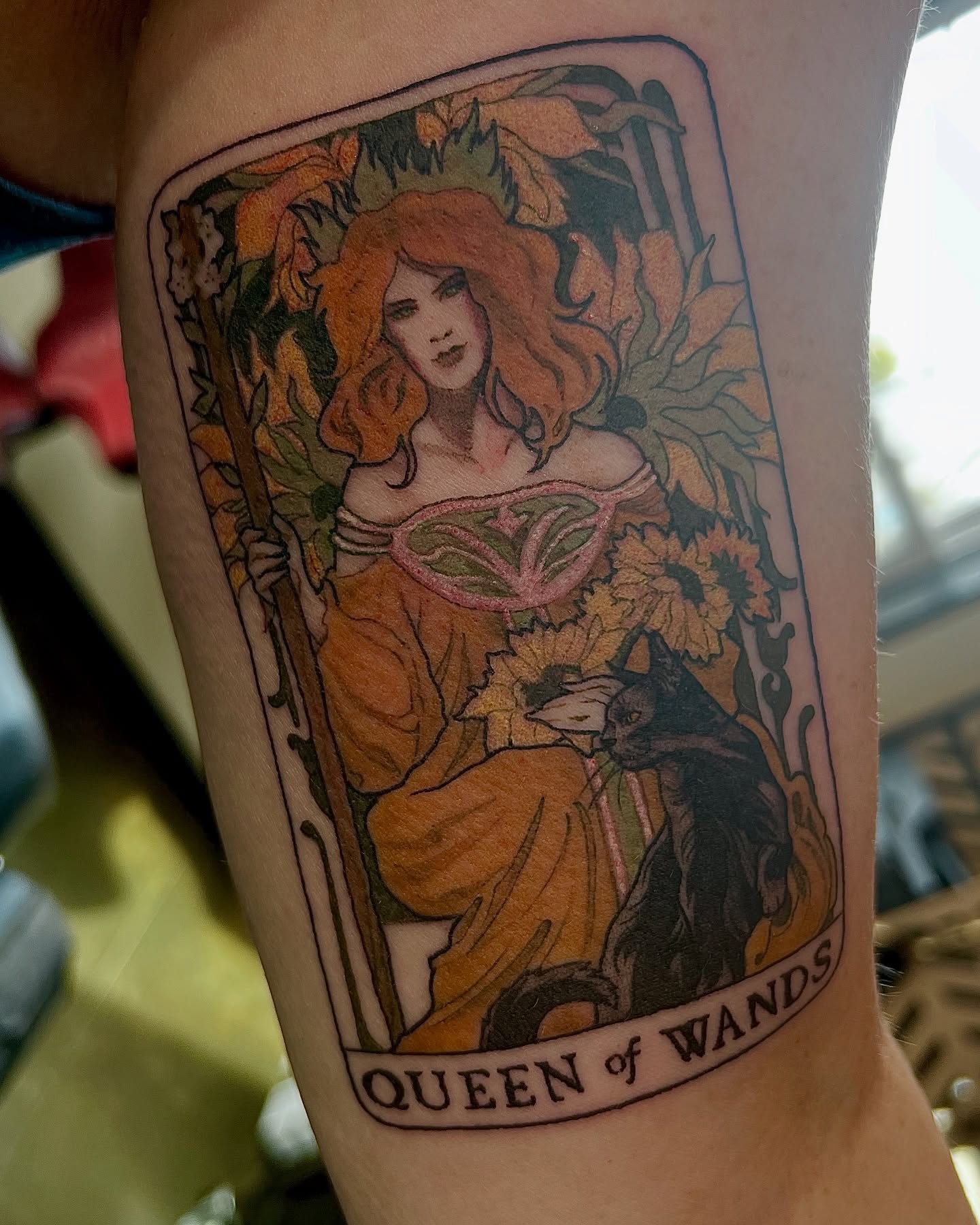 Queen of Wands illustrative tattoo on the forearm by Amanda Leitch