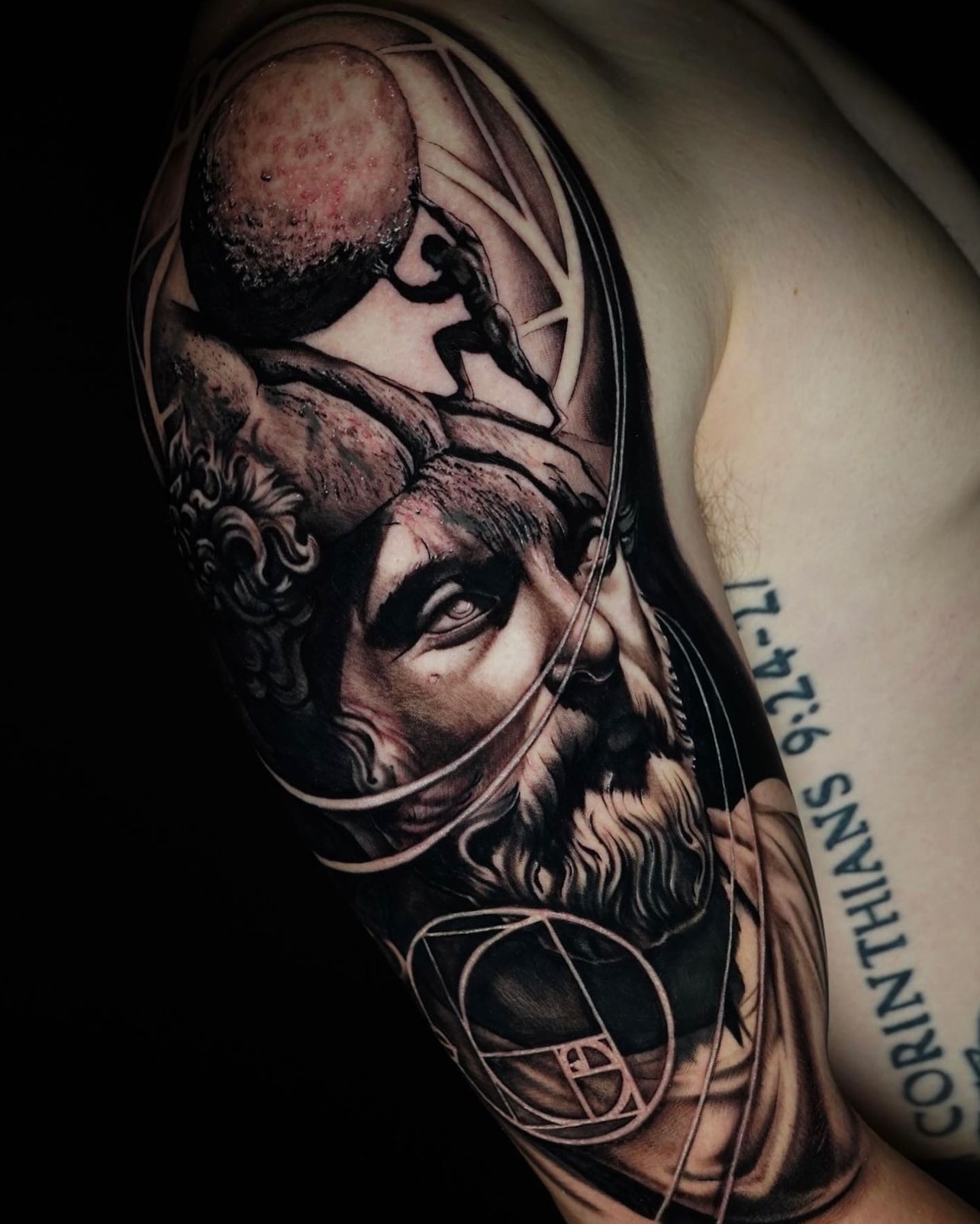 Biblical figure realism tattoo on the upper arm by JoannaTattoos