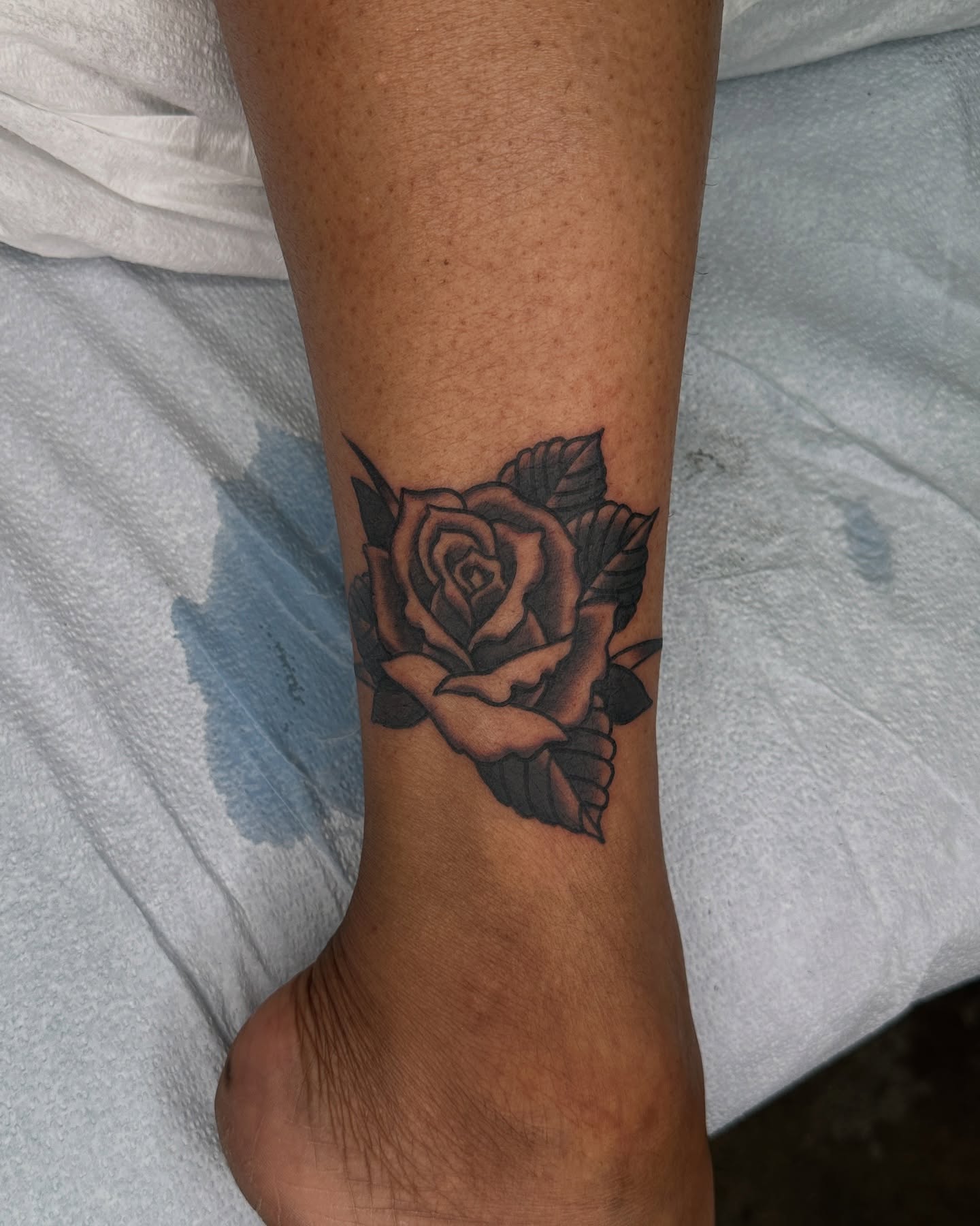 Rose black and grey tattoo on the forearm by Jared, Addison, Texas