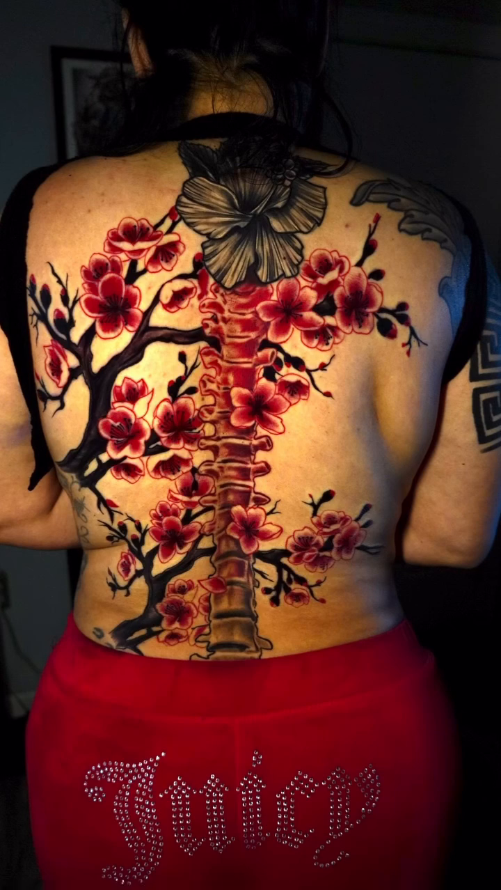 Cherry blossoms and spine japanese irezumi tattoo by Greg Petrali