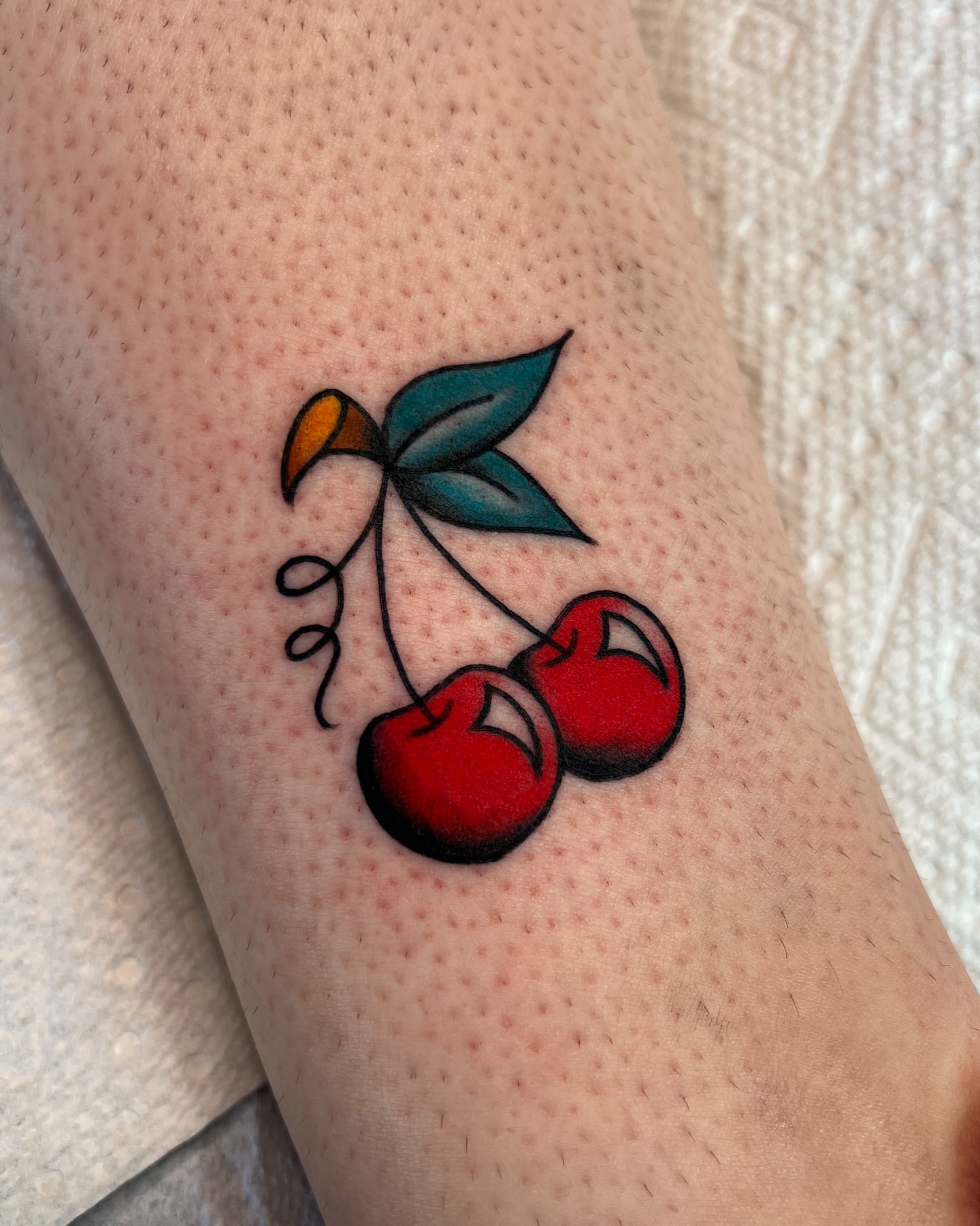 Cherries American traditional tattoo on the forearm by 🍓miranda joon bradbury🍓