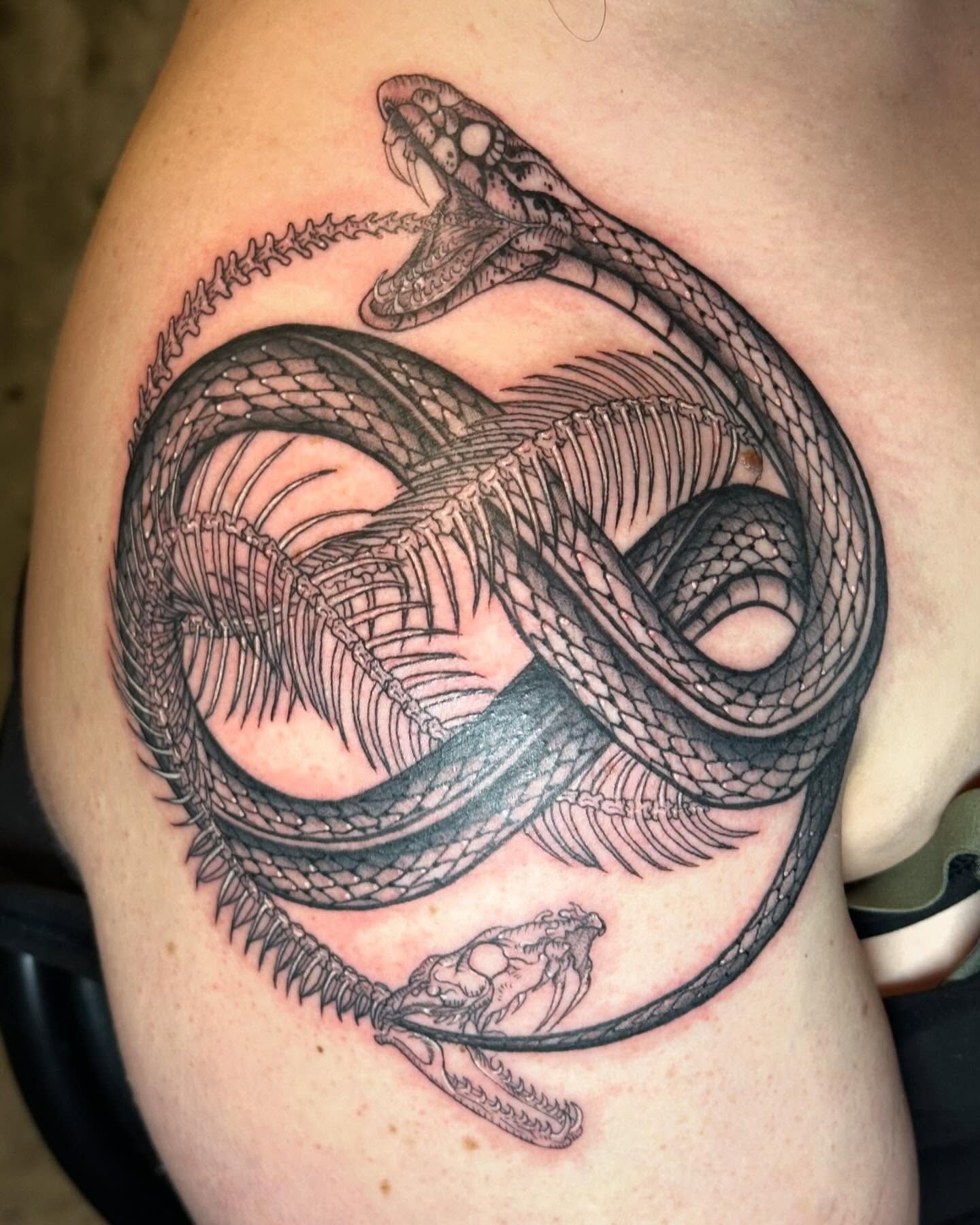 Snake black and grey tattoo on the shoulder by Kerri Colello Sittenauer